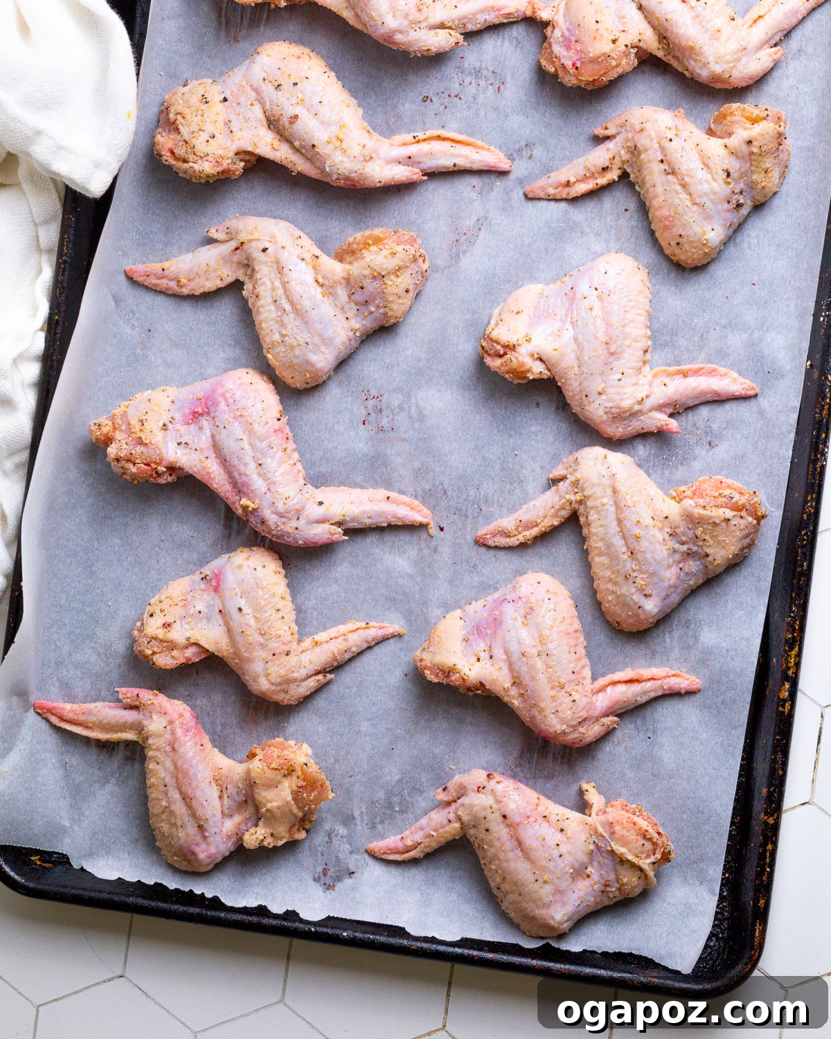 Signature Garlic Parmesan Wings 5 Parmesan Chicken Wings arranged on a baking sheet