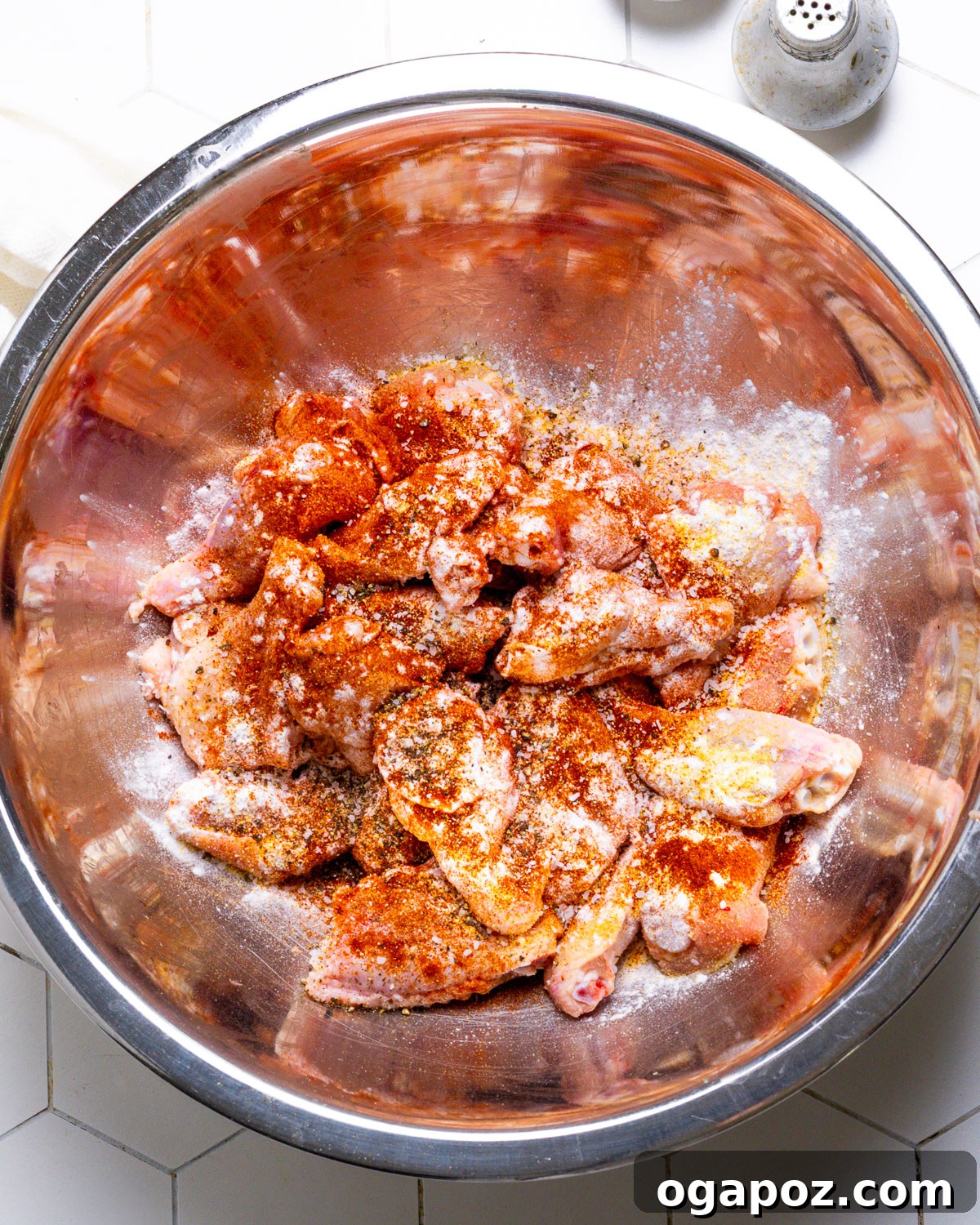 Mango Blaze Wings 4 Preparing chicken wings with seasoning mixture