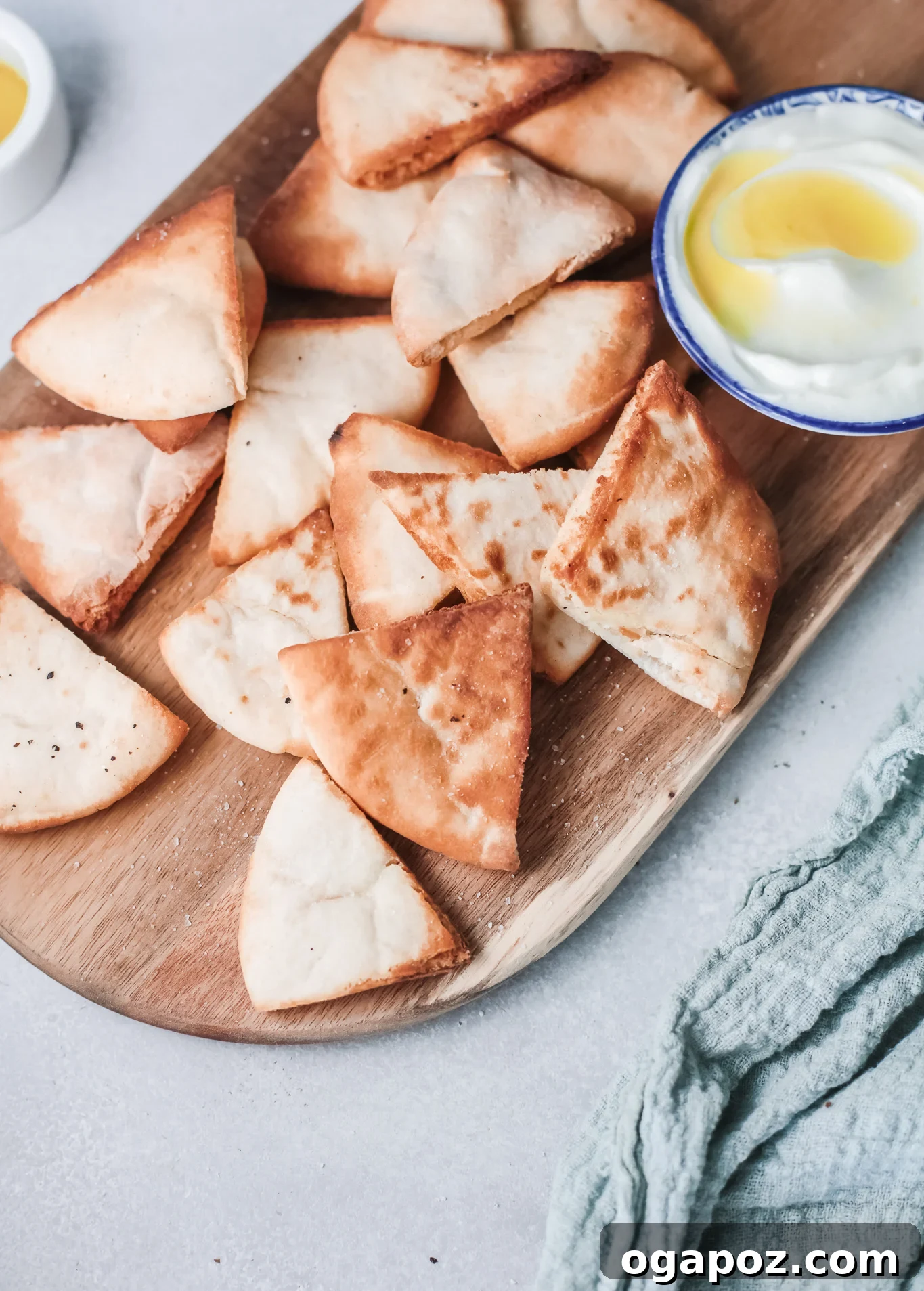 Crispy Air Fryer Pita Chips 4 Air Fryer Pita Chips served with a bowl of fresh tzatziki dip.