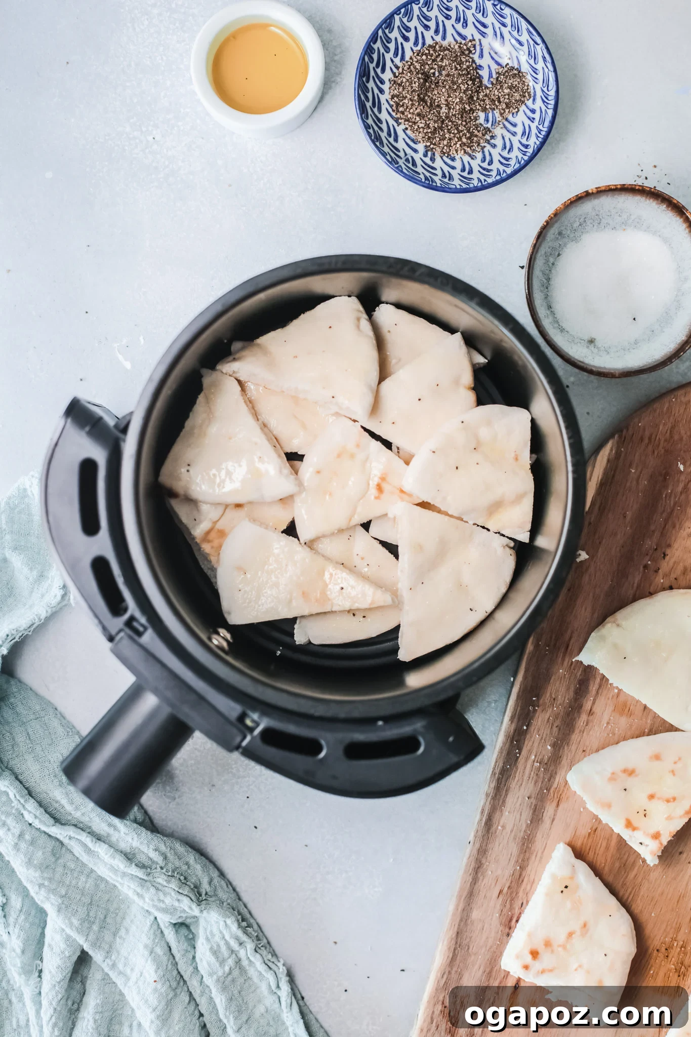 Crispy Air Fryer Pita Chips 6 Pita triangles seasoned and arranged in an air fryer basket.