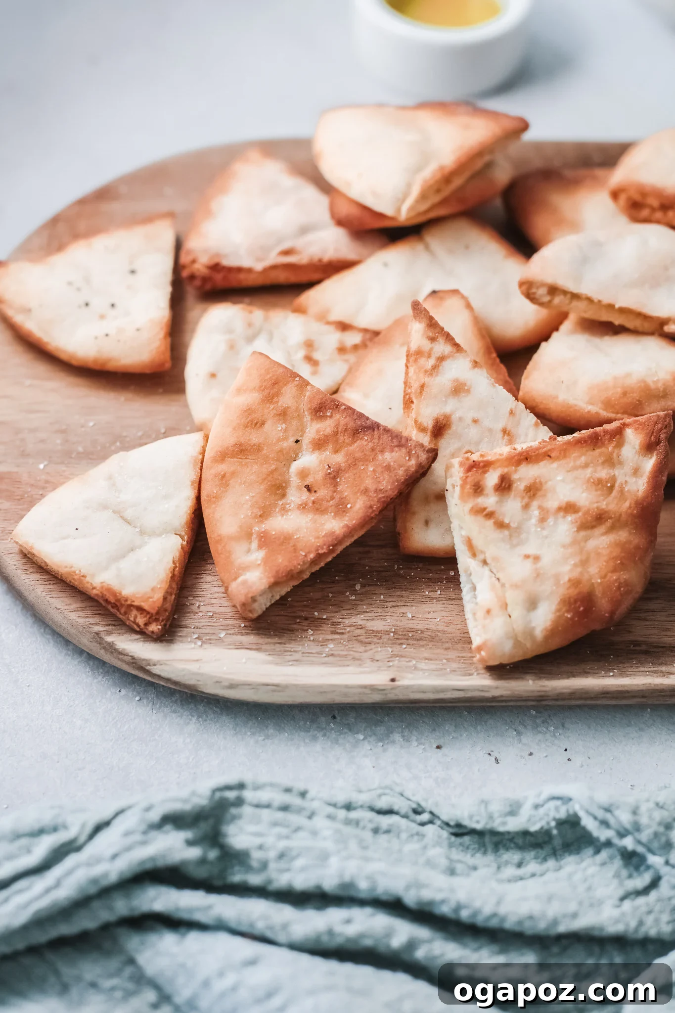 Crispy Air Fryer Pita Chips 8 Close-up of golden Air Fryer Pita Chips with a blue napkin, highlighting their perfect texture.