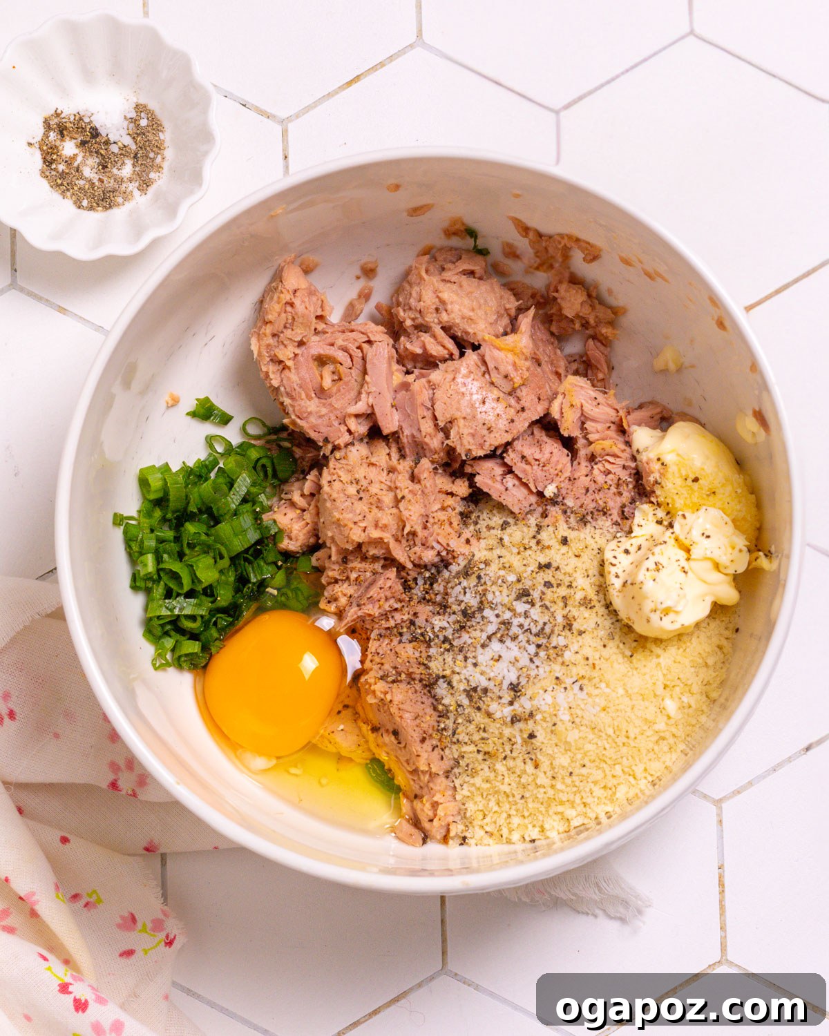 Mixing the tuna patty ingredients in a bowl