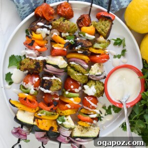Mediterranean Falafel & Veggie Skewers 12 Falafel Vegetable Kabobs on white plate.