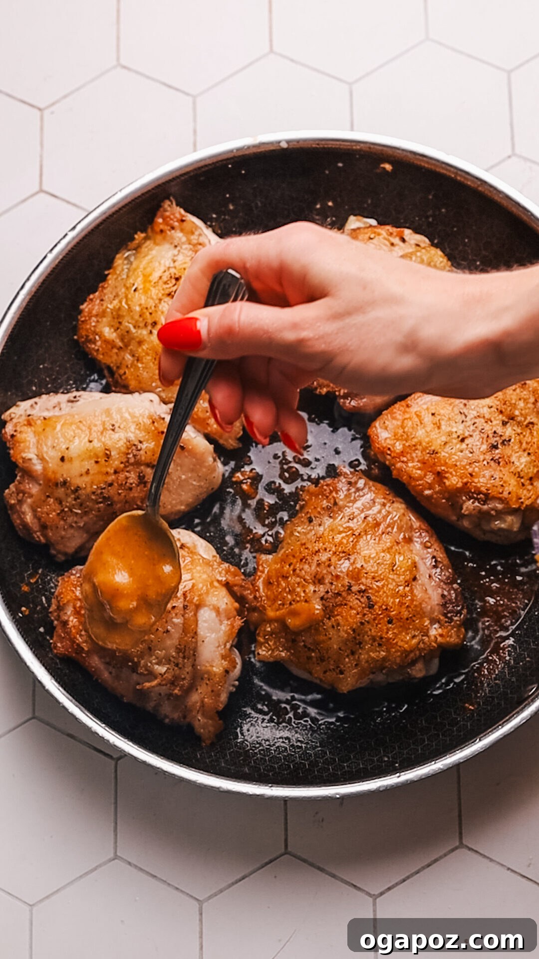 Honey Mustard Glazed Chicken 7 Step 4: Spooning honey mustard glaze over seared chicken in a skillet.