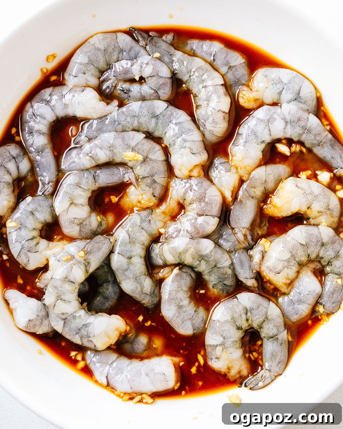 Sticky Teriyaki Shrimp 5 Step 2: Raw shrimp tossed in teriyaki marinade, ready for cooking.