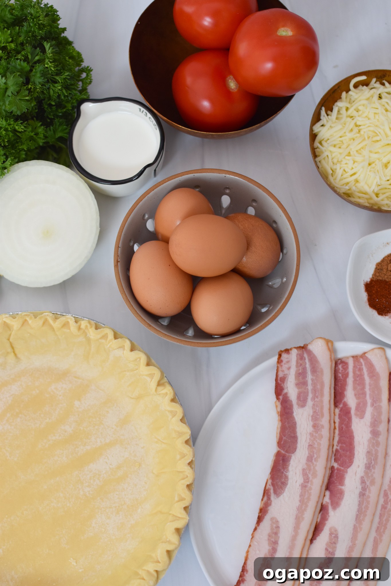 Italian Summer Quiche Lorraine 3 A selection of fresh ingredients including bacon, eggs, cheese, tomatoes, and herbs laid out for Caprese Quiche Lorraine.