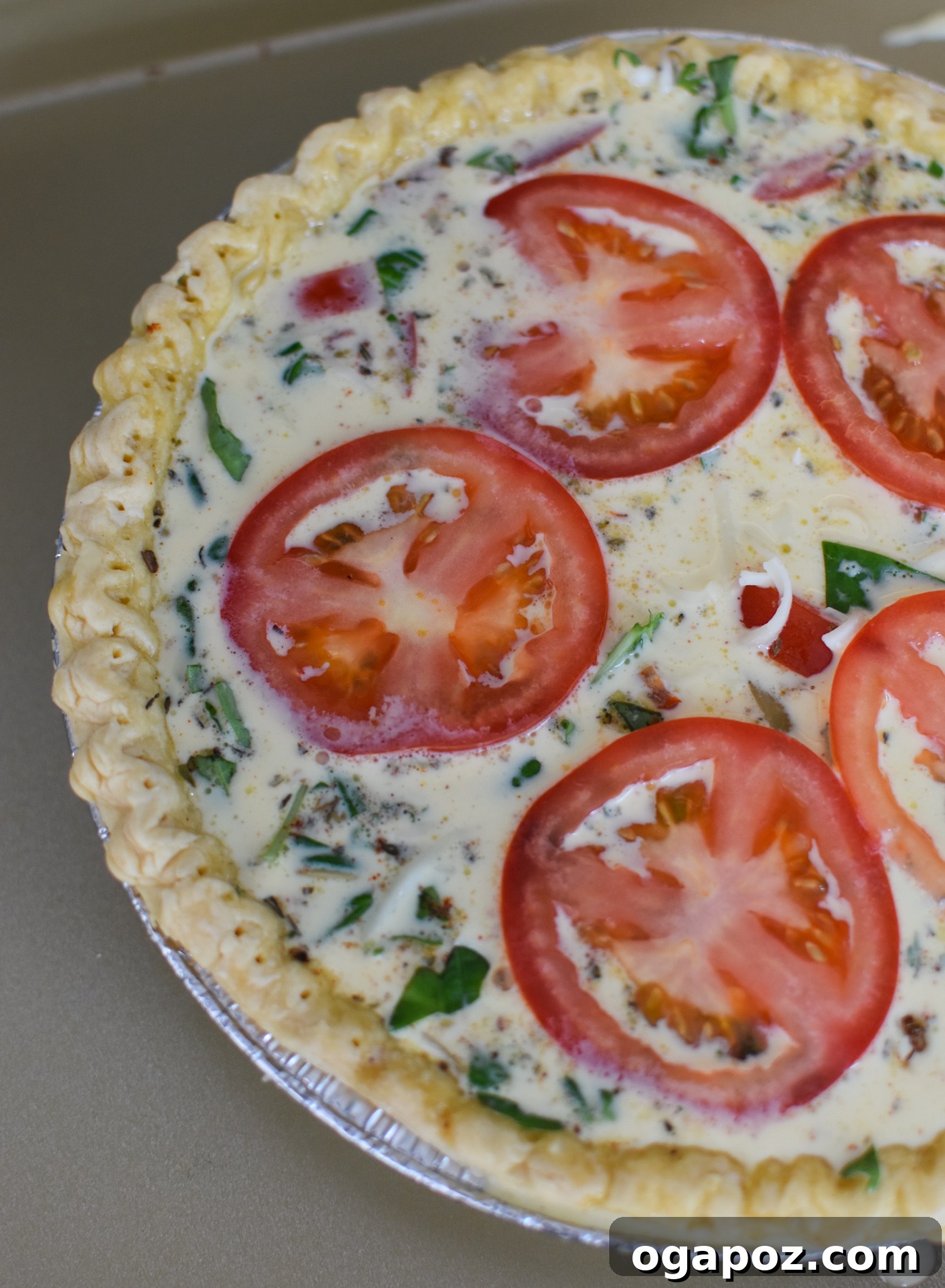 Italian Summer Quiche Lorraine 9 Thinly sliced tomatoes arranged beautifully on top of the Caprese Quiche Lorraine before baking.