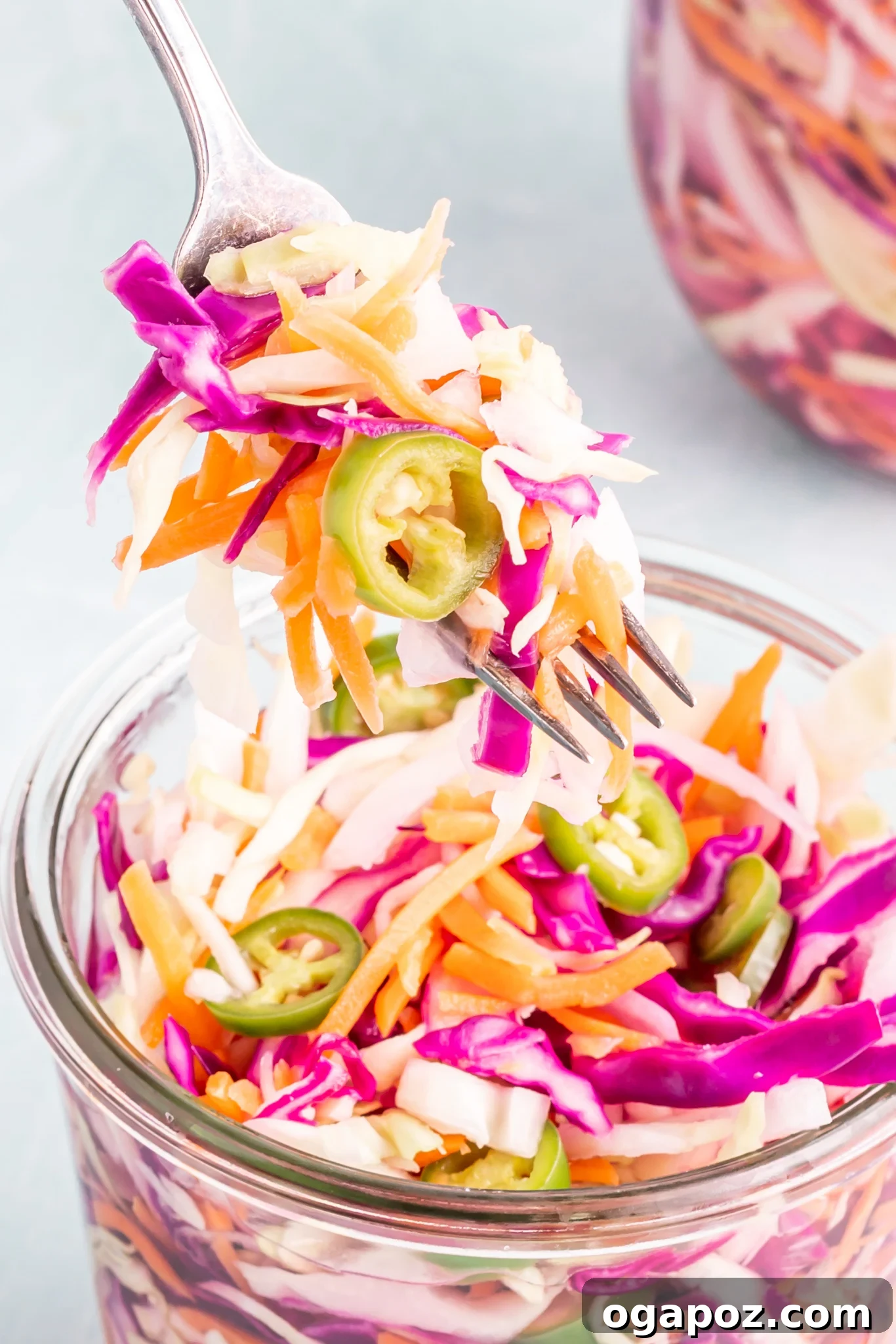 Effortless Salvadoran Curtido 4 Easy Curtido Recipe in a glass jar with a fork.