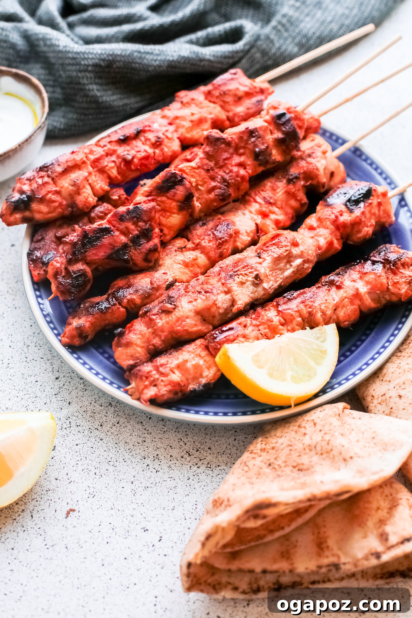 Marinated Lebanese Chicken Skewers 4 Lebanese Chicken Kebabs with lemon wedge.