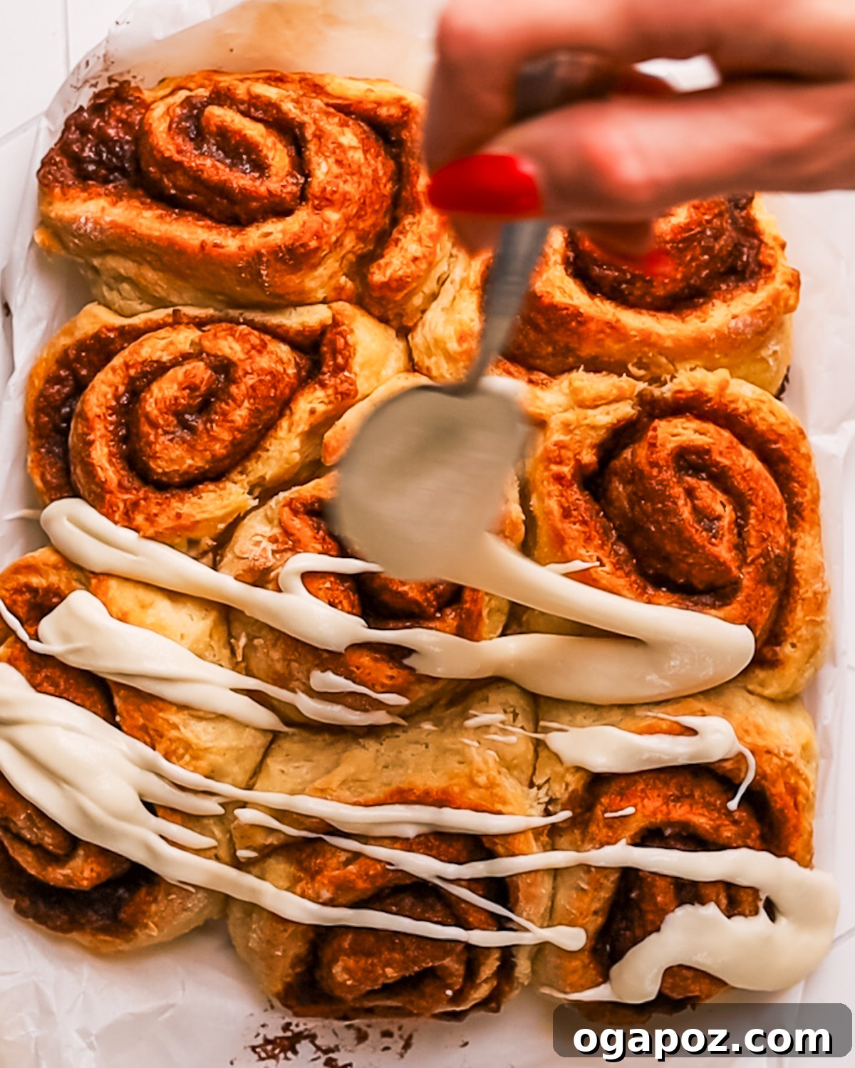 Fluffy No Yeast Biscuit Cinnamon Rolls 2 Biscuit Cinnamon Rolls drizzled with cream cheese icing.