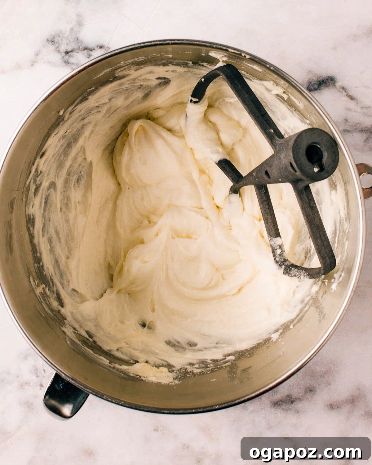 Perfect Cream Cheese Frosting 5 Thick cream cheese frosting in a bowl, ready for frosting cakes.