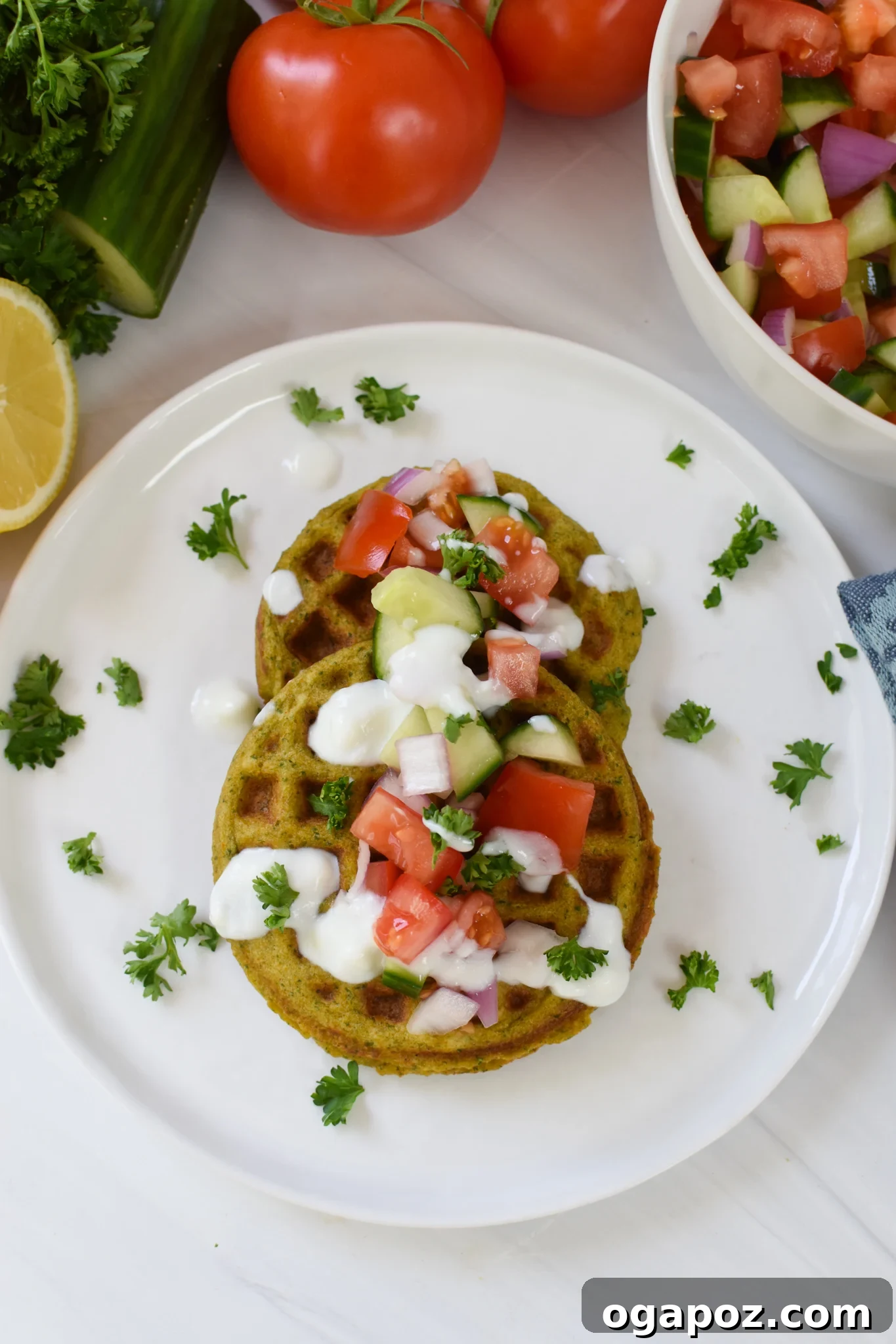 Waffled Falafel 2 Crispy golden Falafel Waffles served on a pristine white plate, garnished with fresh herbs and a side of tahini.