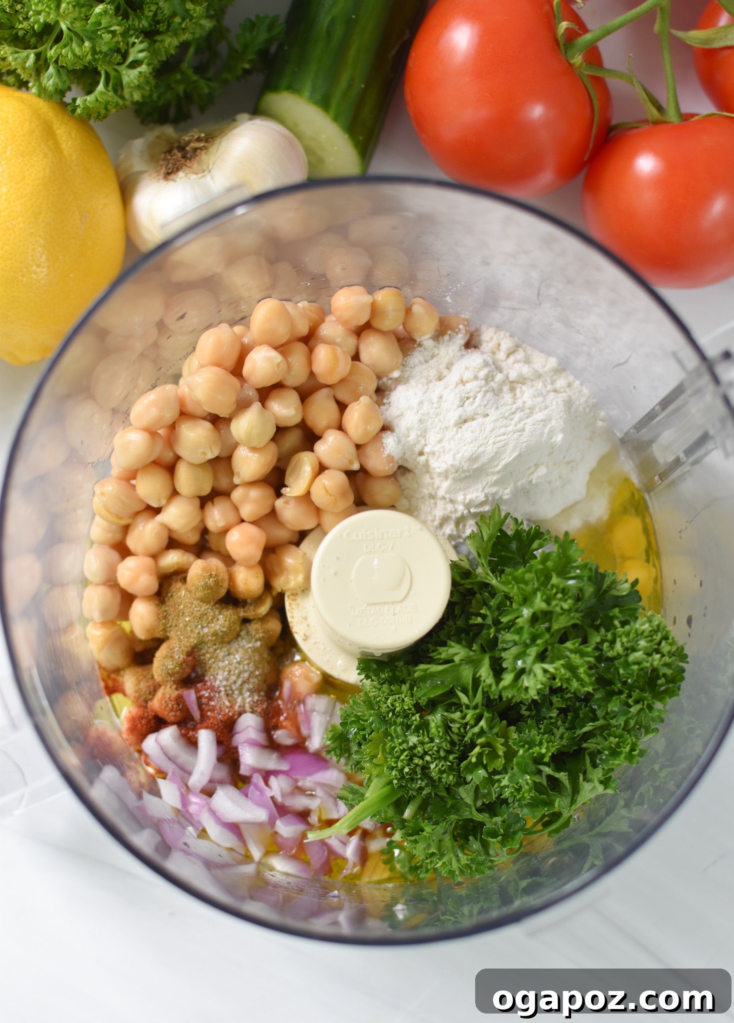 Waffled Falafel 5 All the Falafel Waffles ingredients, including chickpeas, spices, and fresh herbs, loaded into a food processor ready for blending.