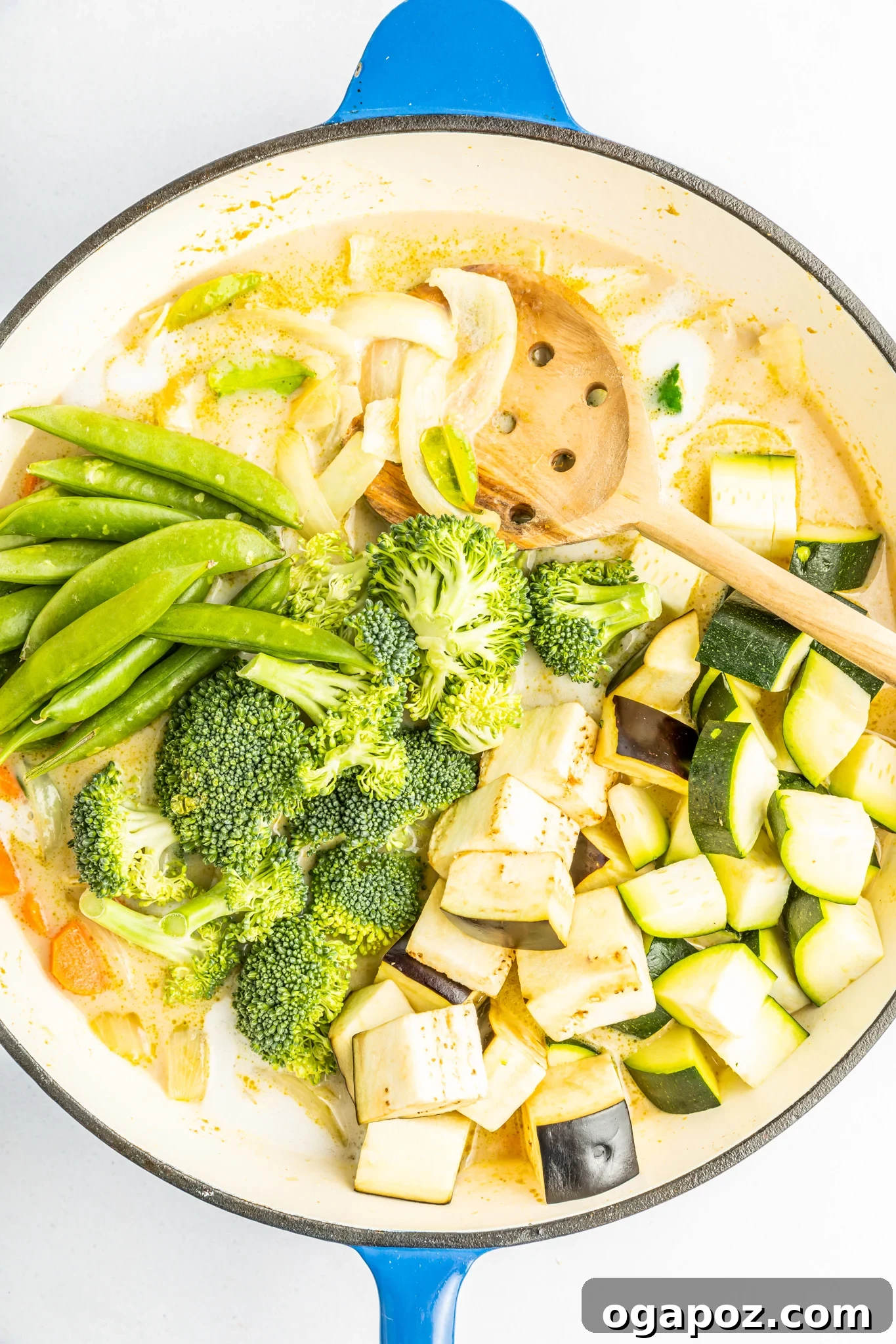 Quick & Delicious Thai Veggie Green Curry 6 The rich and creamy Thai Vegetable Green Curry sauce simmering gently in a large pot, filled with colorful vegetables and aromatic spices, promising a deeply satisfying meal.