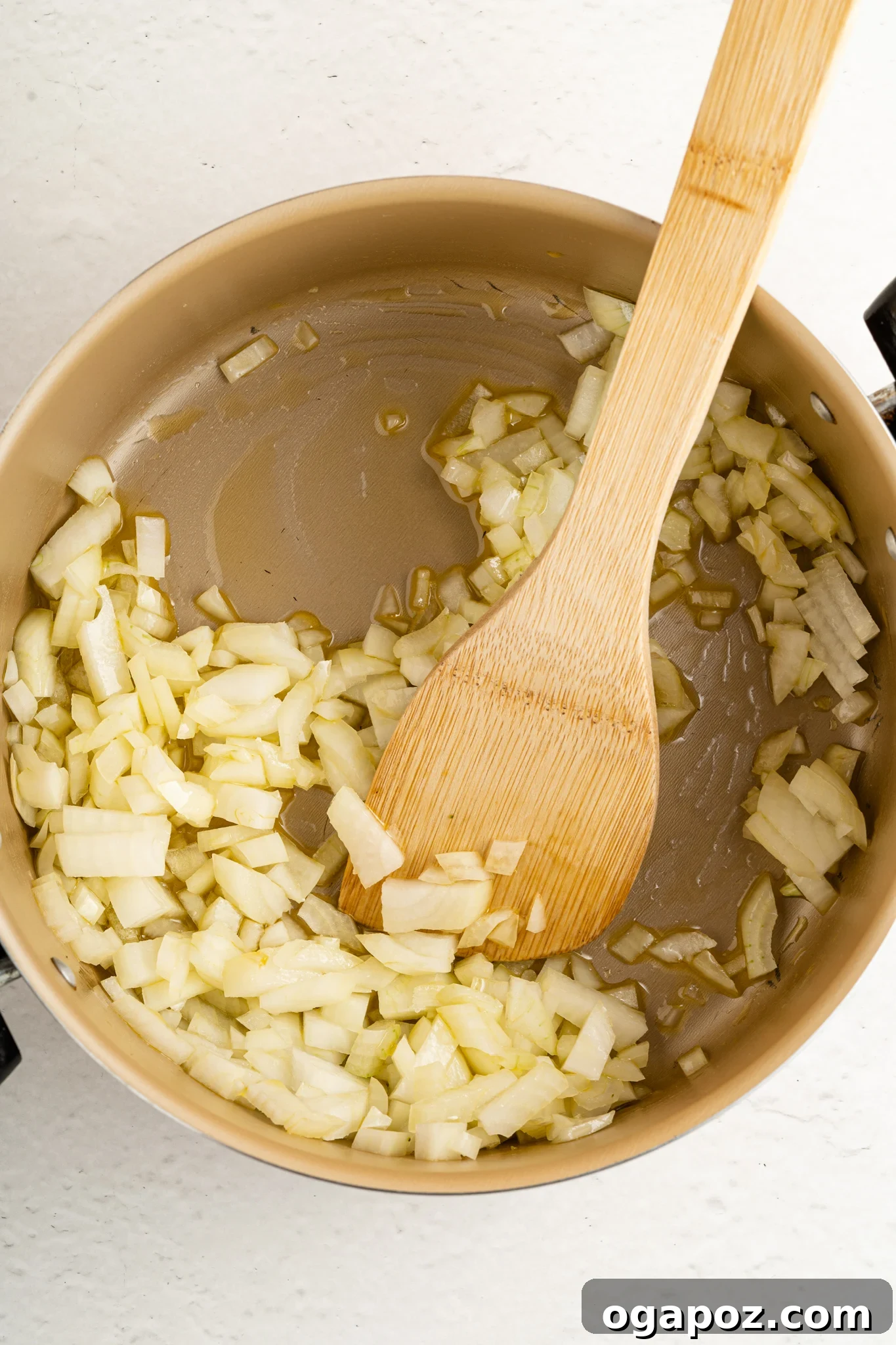 Velvety Creamy Broccoli Pasta 6 Sautéing onions and garlic in a skillet for Creamy Broccoli Pasta.