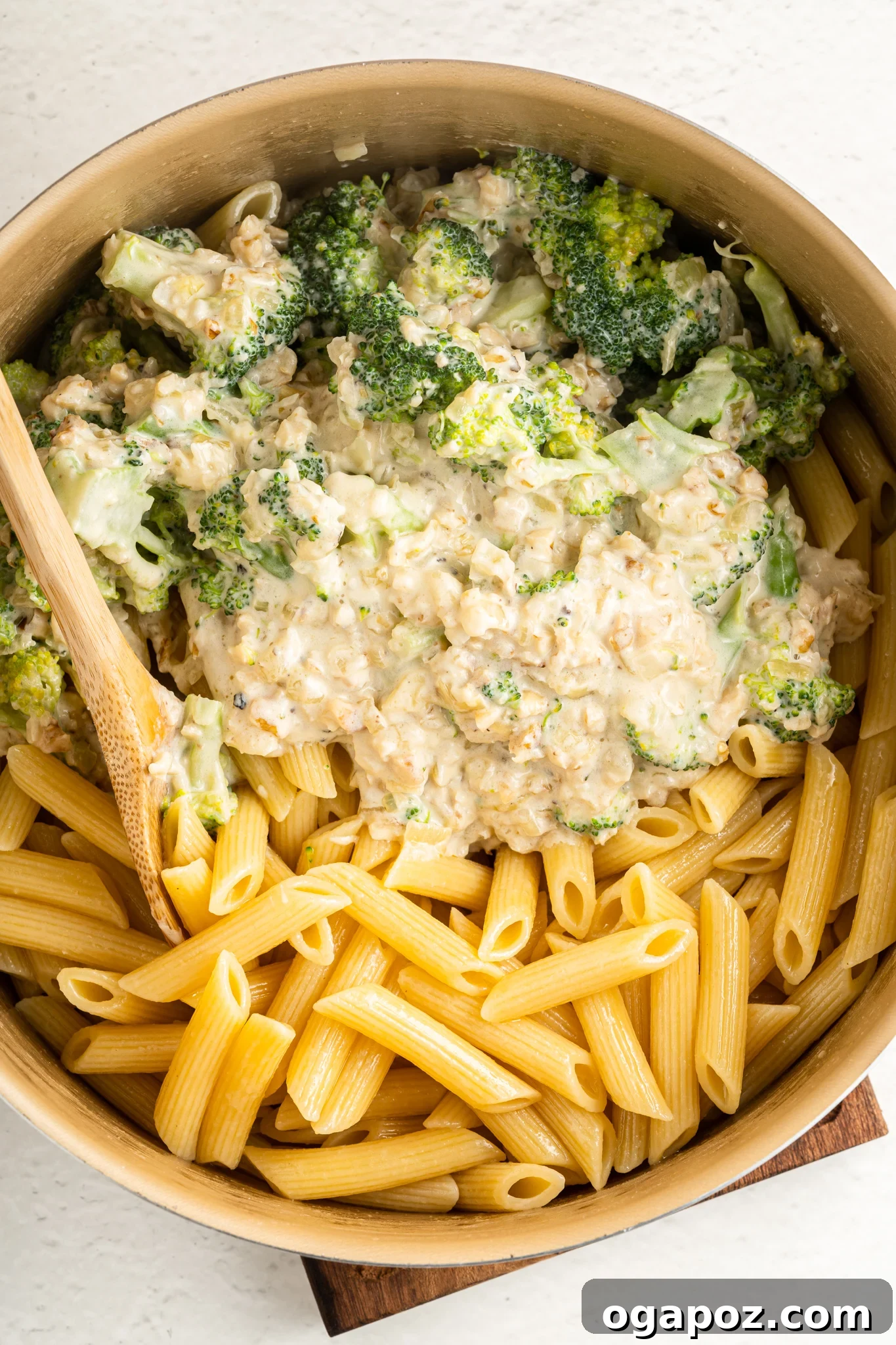 Velvety Creamy Broccoli Pasta 7 Creamy Broccoli Pasta ingredients mixing in a large pot.