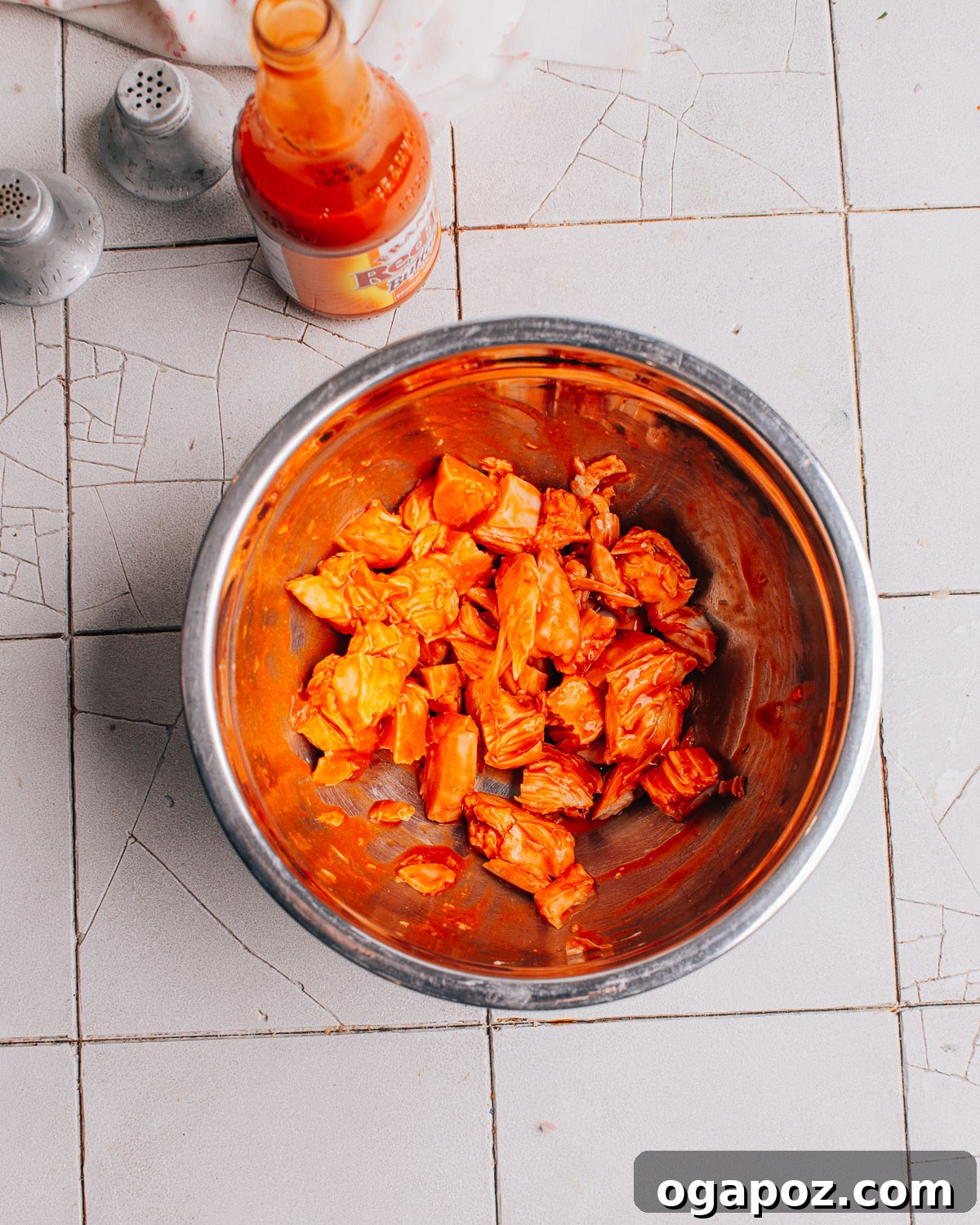 Ingredients being prepared for Buffalo Chicken Pasta Salad.