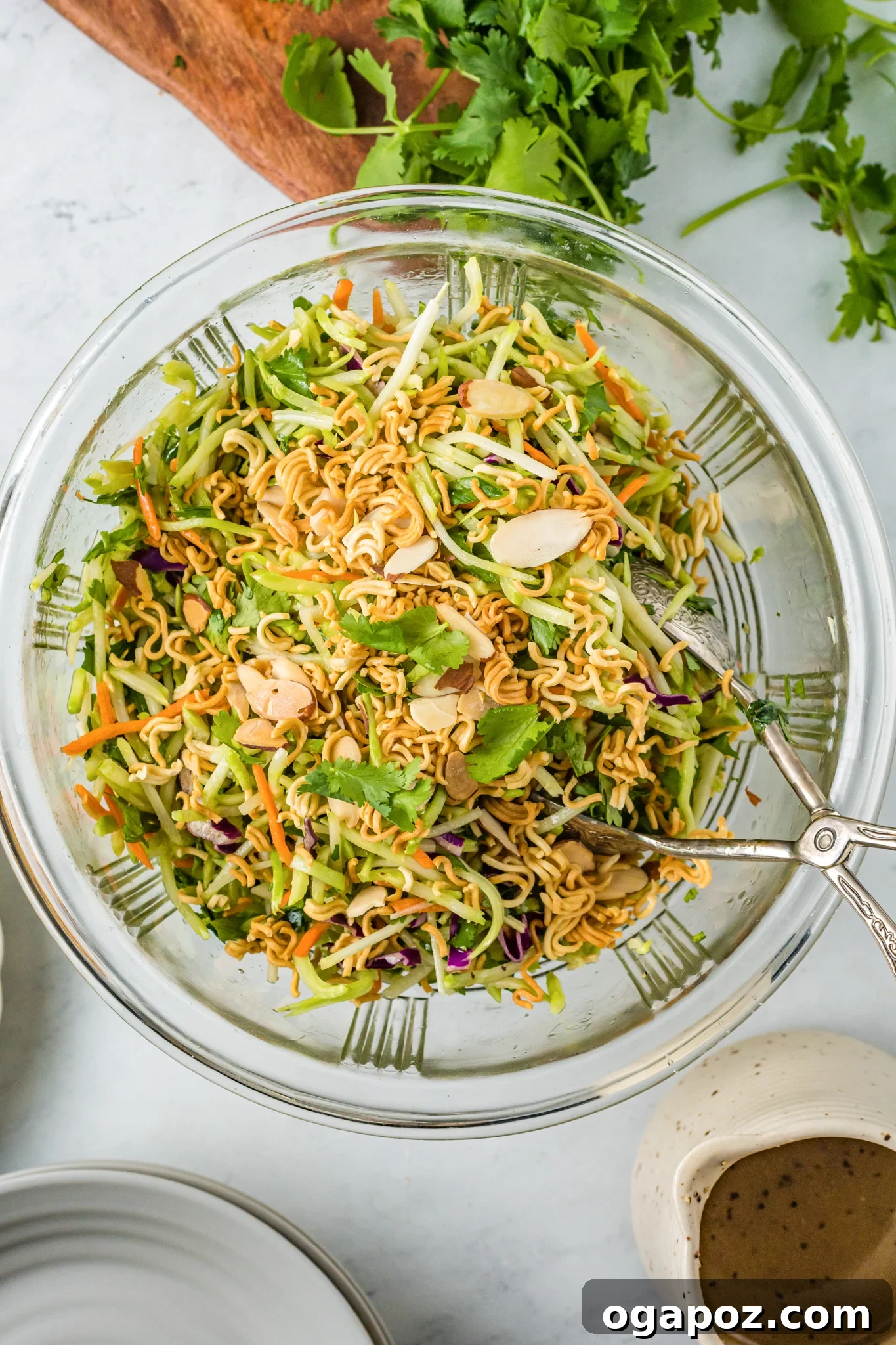 The Ultimate Broccoli Slaw 5 Broccoli Slaw Recipe in a clear glass bowl, ready to be served, showcasing its freshness.