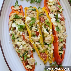 Mediterranean Tuna Couscous Stuffed Peppers on a white platter.