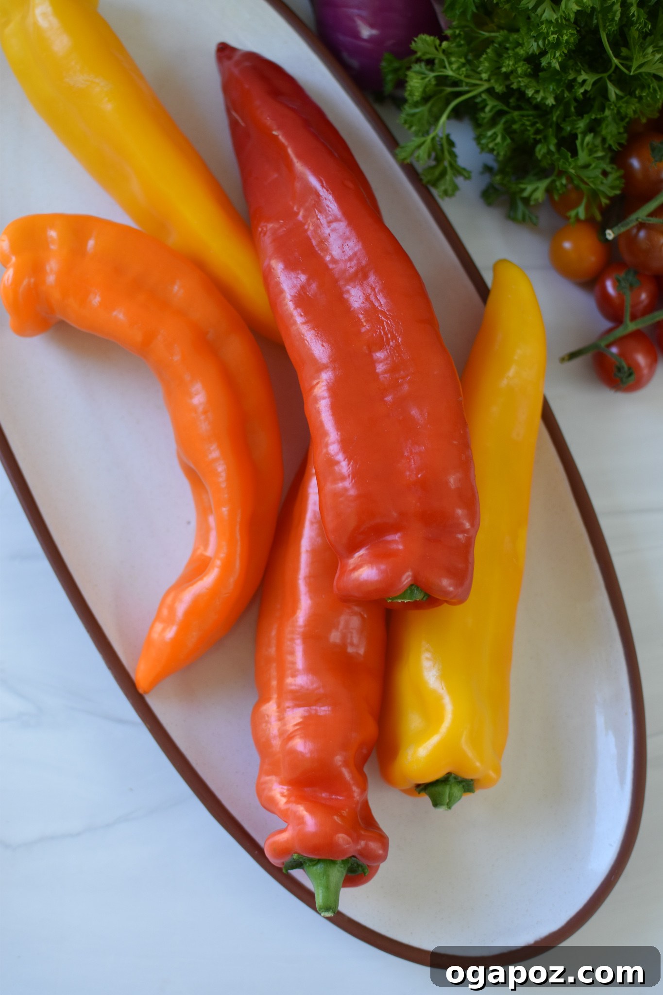Sun-Kissed Mediterranean Tuna Couscous Peppers 5 Sweet peppers, cut lengthwise and hollowed, are arranged on a cutting board, ready for stuffing.