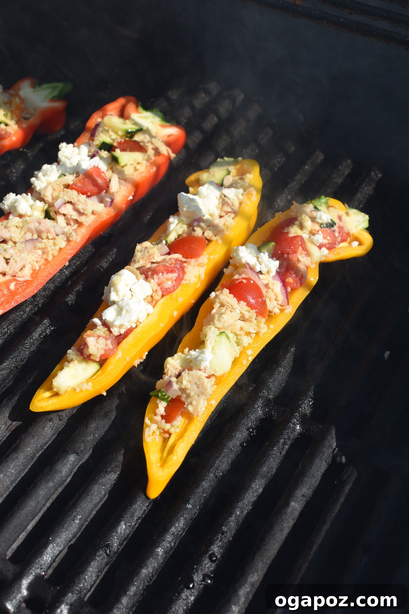 Sun-Kissed Mediterranean Tuna Couscous Peppers 8 Mediterranean Tuna Couscous Stuffed Peppers cooking on a hot grill, showing the slight char and tender texture.