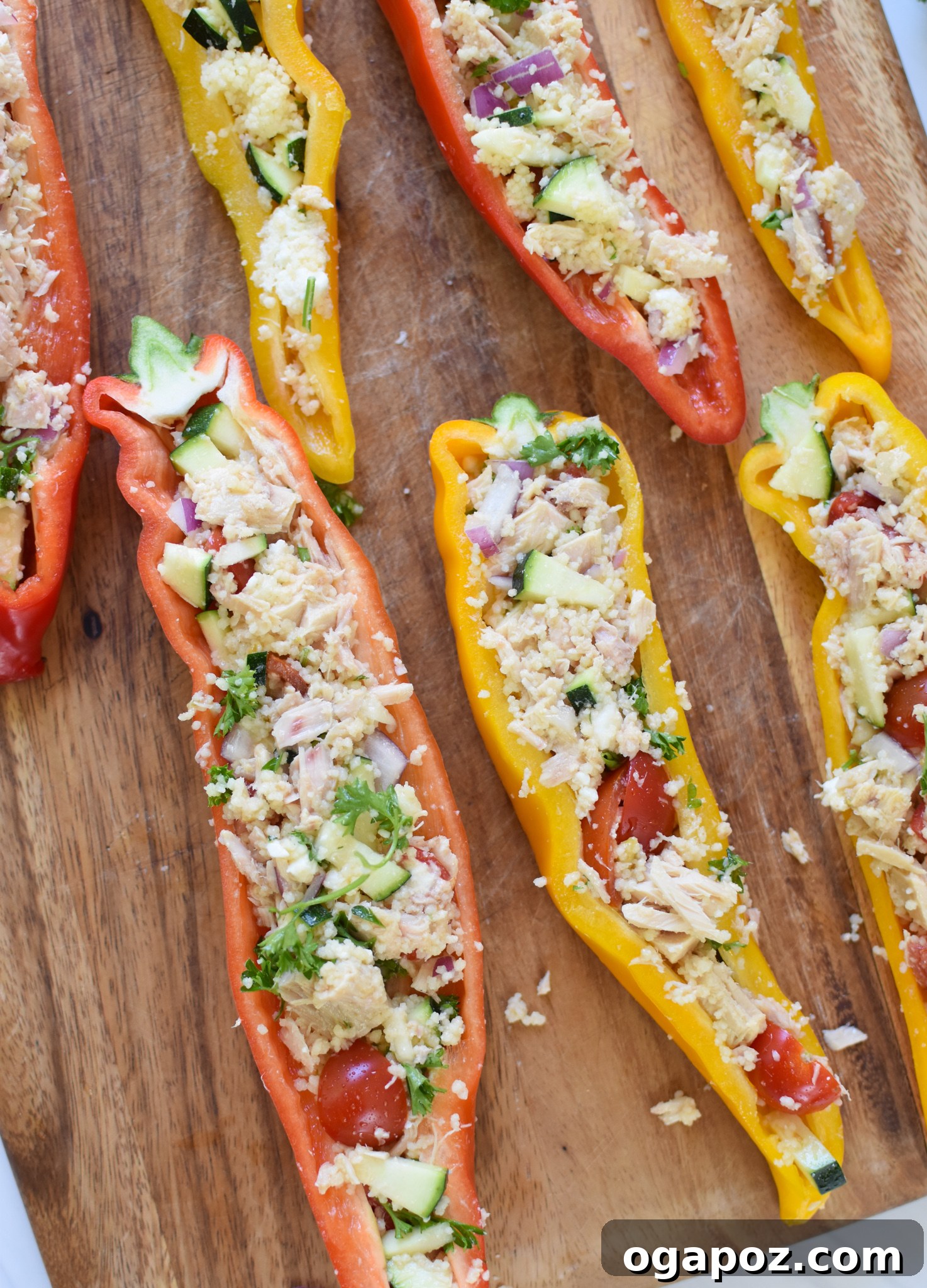 Sun-Kissed Mediterranean Tuna Couscous Peppers 9 Mediterranean Tuna Couscous Stuffed Peppers, neatly cut and filled, ready for cooking.