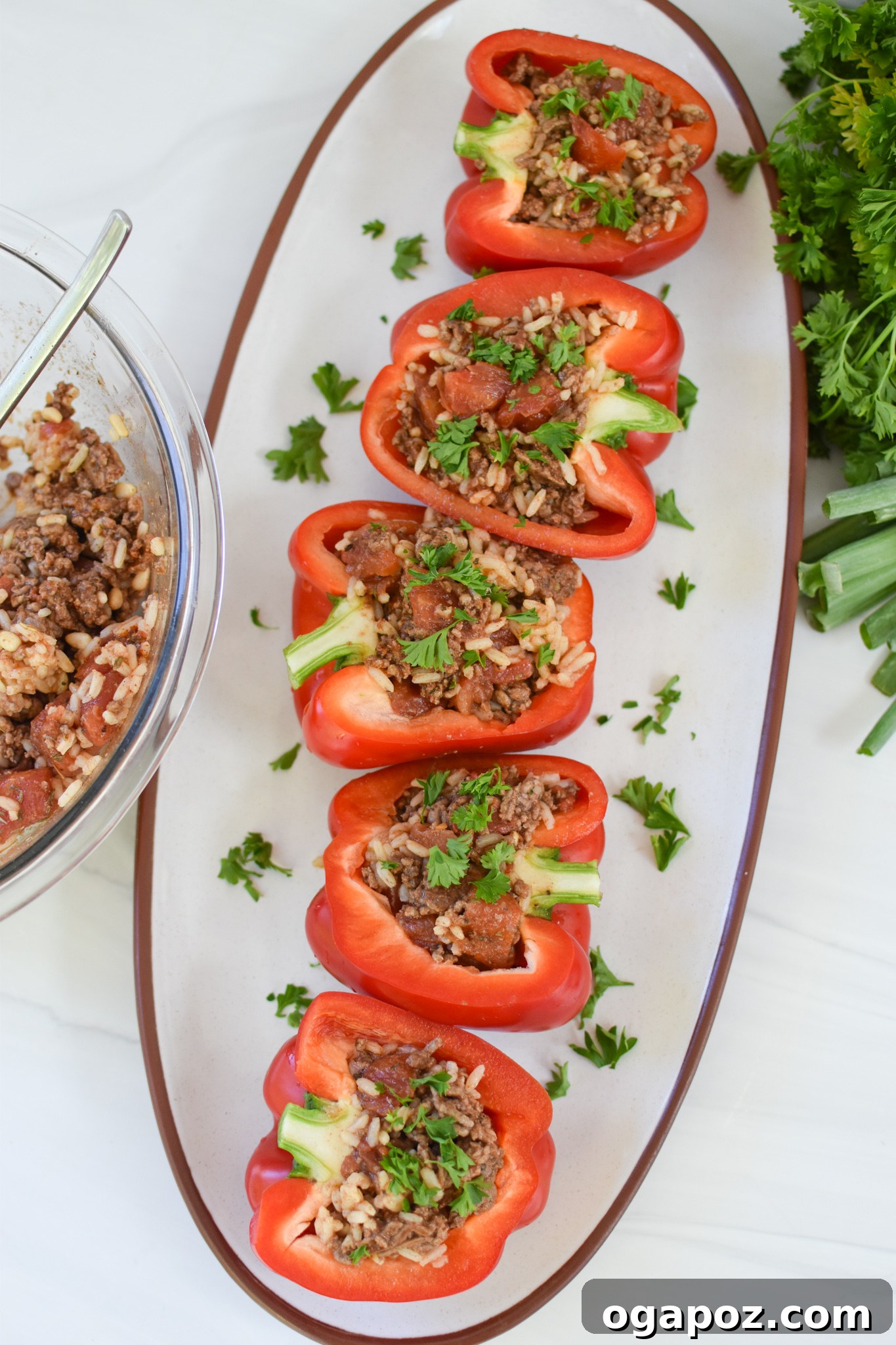 Mediterranean Beef Filled Bell Peppers 11 Mediterranean Ground Beef Stuffed Peppers on a white plate.