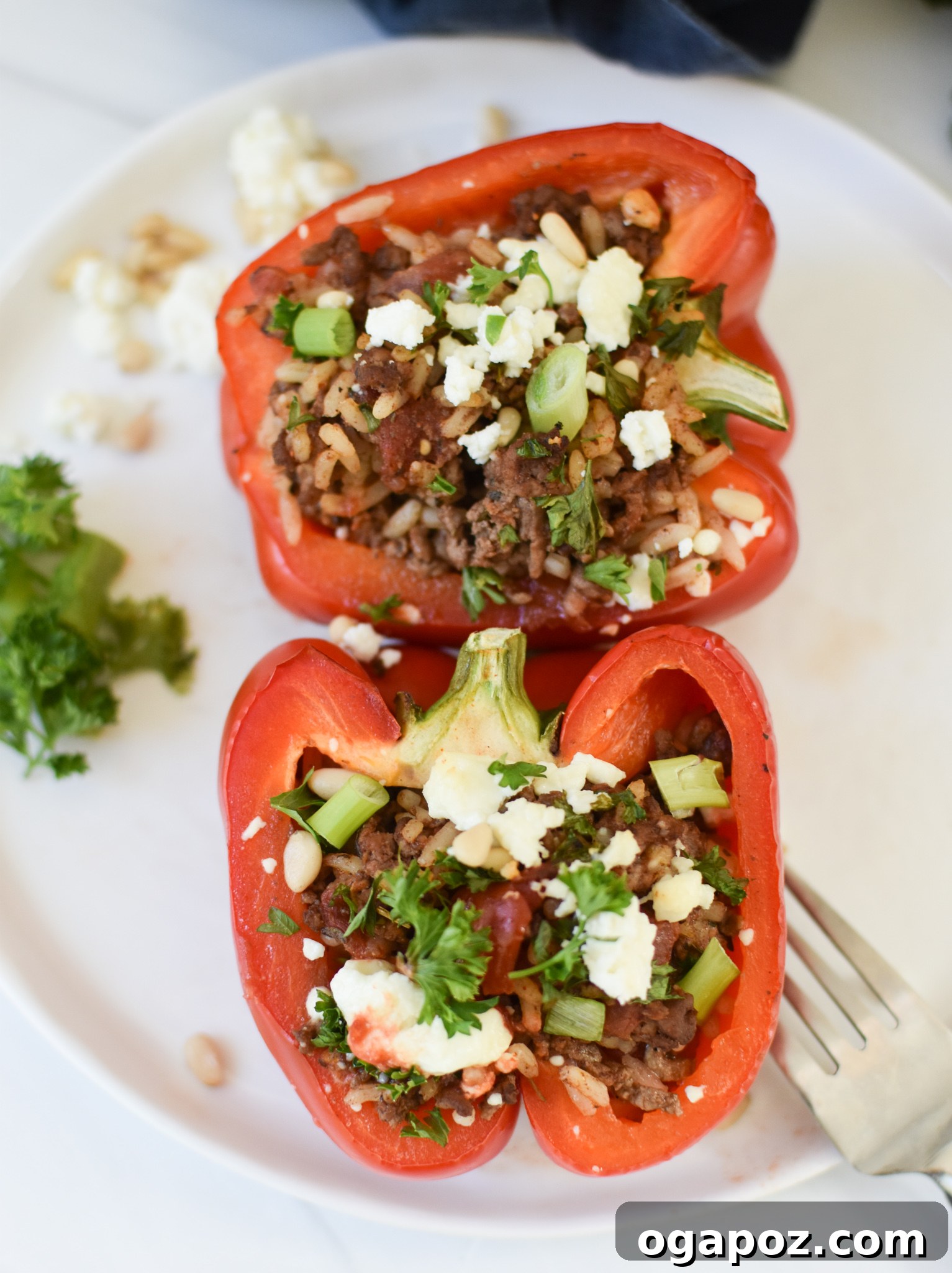 Mediterranean Beef Filled Bell Peppers 6 Mediterranean Ground Beef Stuffed Peppers on a white plate.