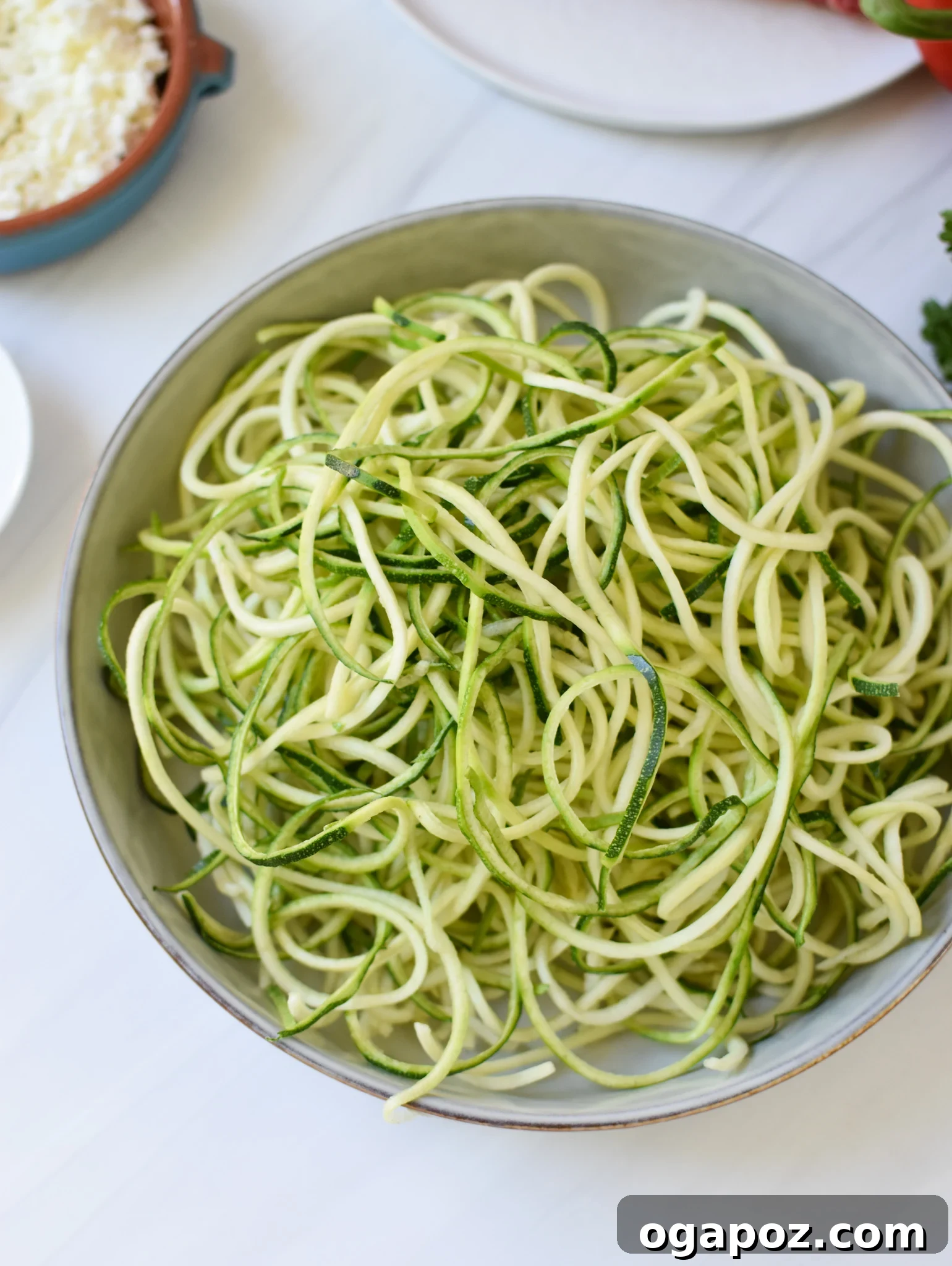 Vibrant Mediterranean Beef and Zucchini Skillet 6 Mediterranean Ground Beef Zucchini Skillet ingredients: zucchini noodles in a bowl.