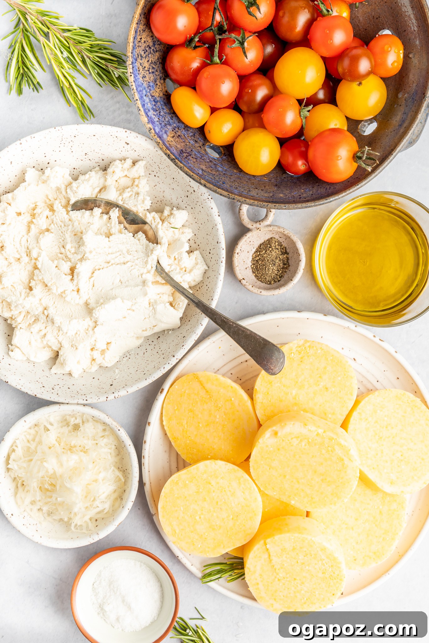 Golden Polenta Towers 3 Fresh ingredients laid out for Crispy Polenta Stacks, including polenta, cherry tomatoes, rosemary, and ricotta.