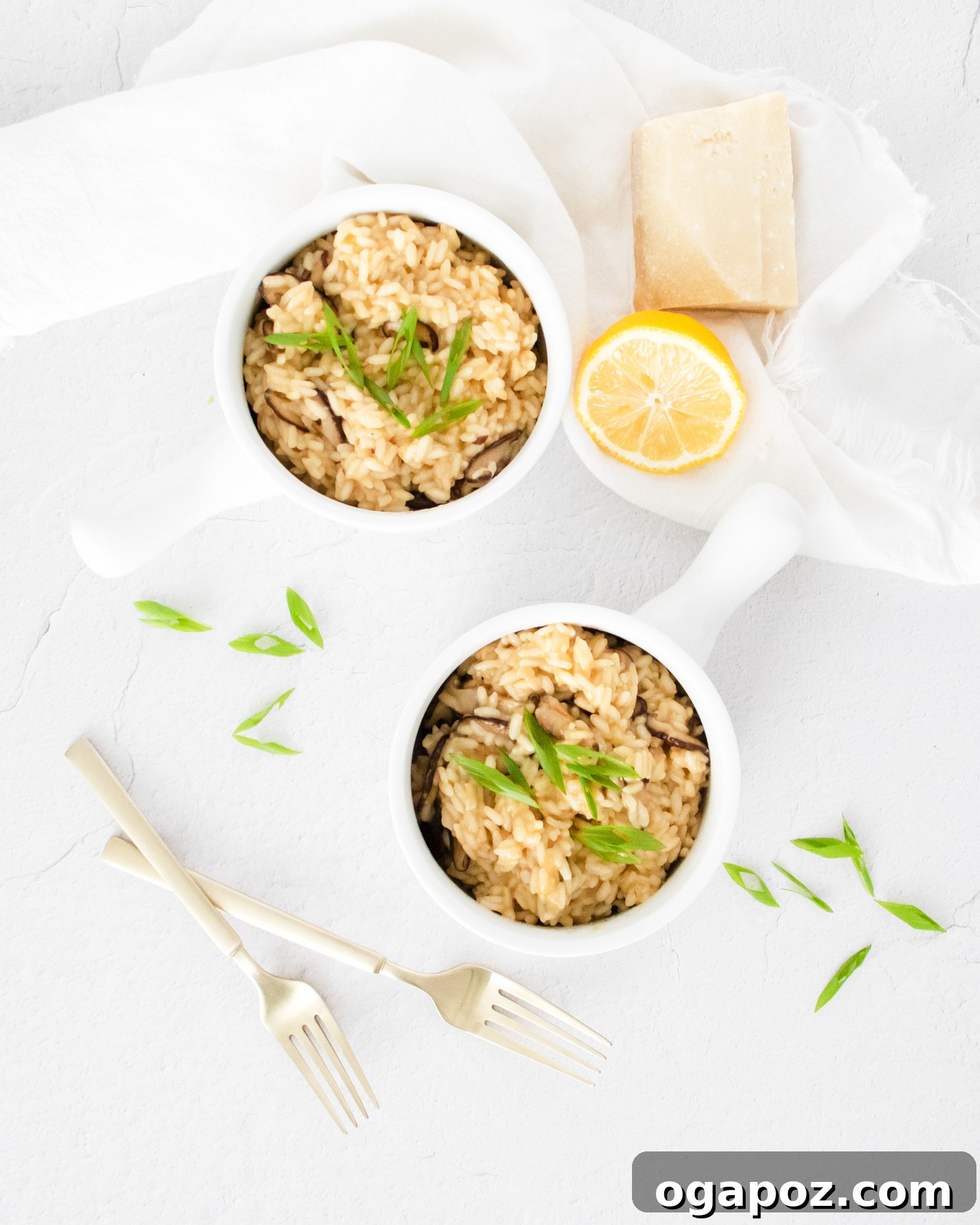 Creamy Instant Pot Mushroom Risotto 9 A serving of Instant Pot Mushroom Risotto garnished with a lemon slice and fresh herbs.