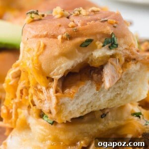 A square image of Chicken Enchilada Sliders, golden brown and cheesy.