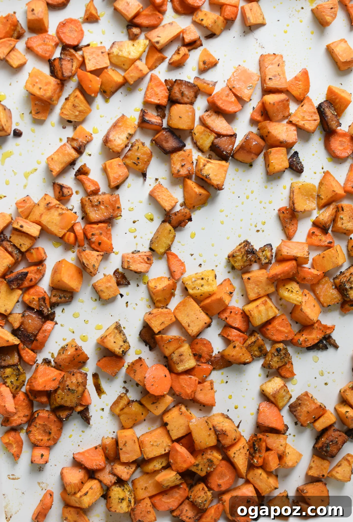 Golden Roasted Vegetable Medley 9 Roasted butternut squash and sweet potatoes spread on a baking sheet, golden and tender.