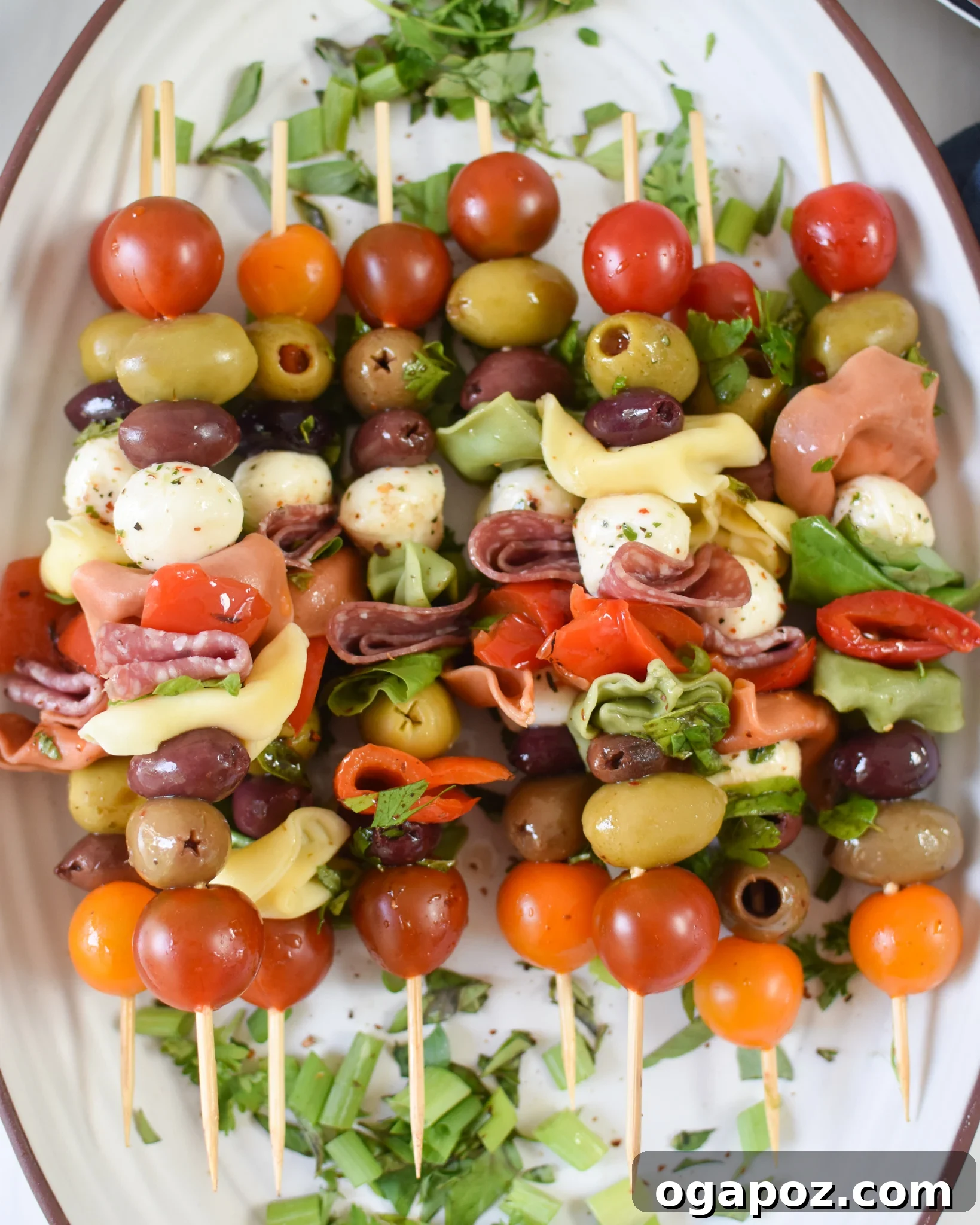 Flavorful Skewer Bites 8 Antipasto Skewers presented on a elegant white plate, ready to be enjoyed.