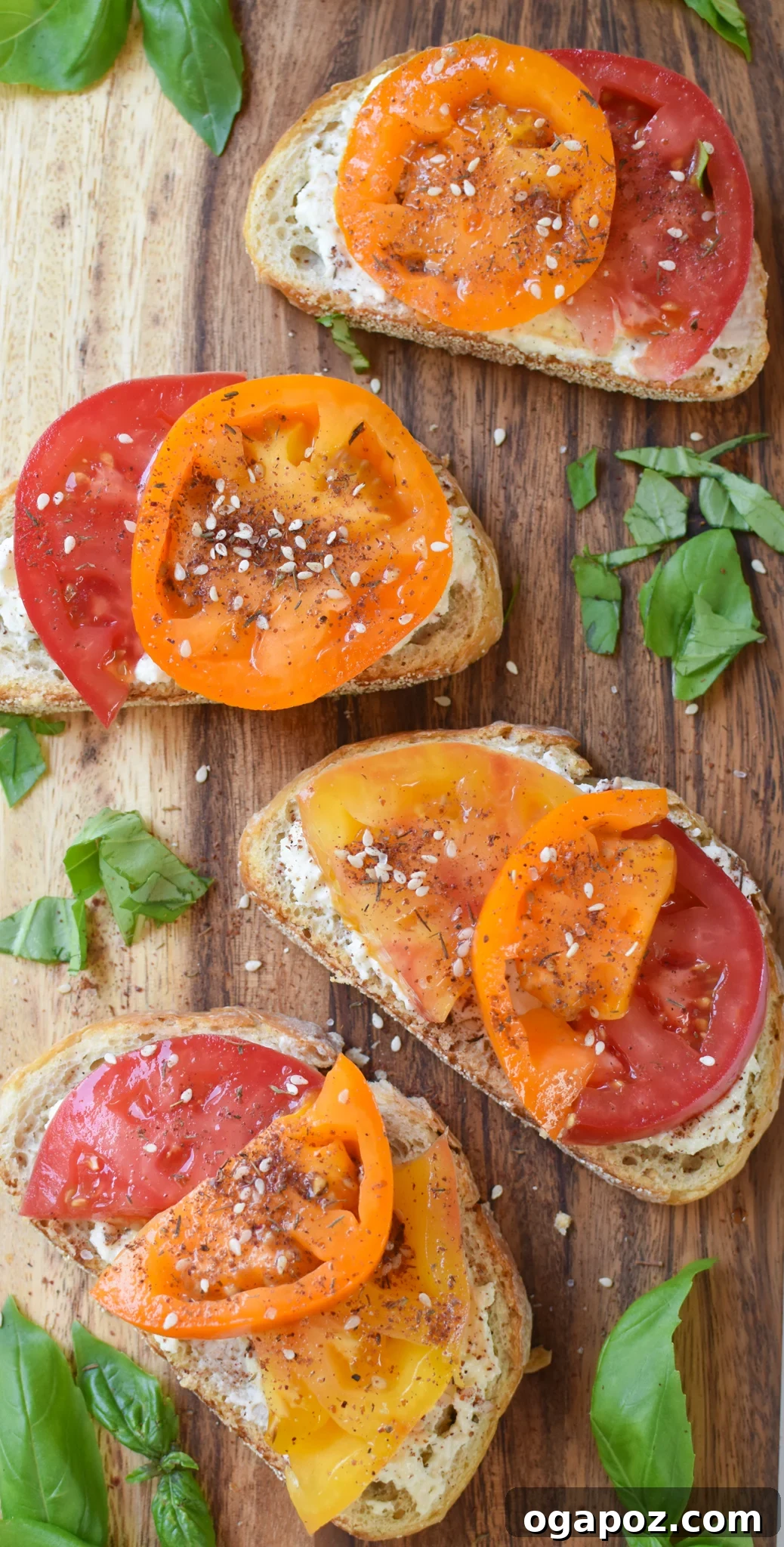Heirloom Tomato Toast with Fluffy Feta 7 Tomato Toast with Whipped Feta toast on a cutting board.