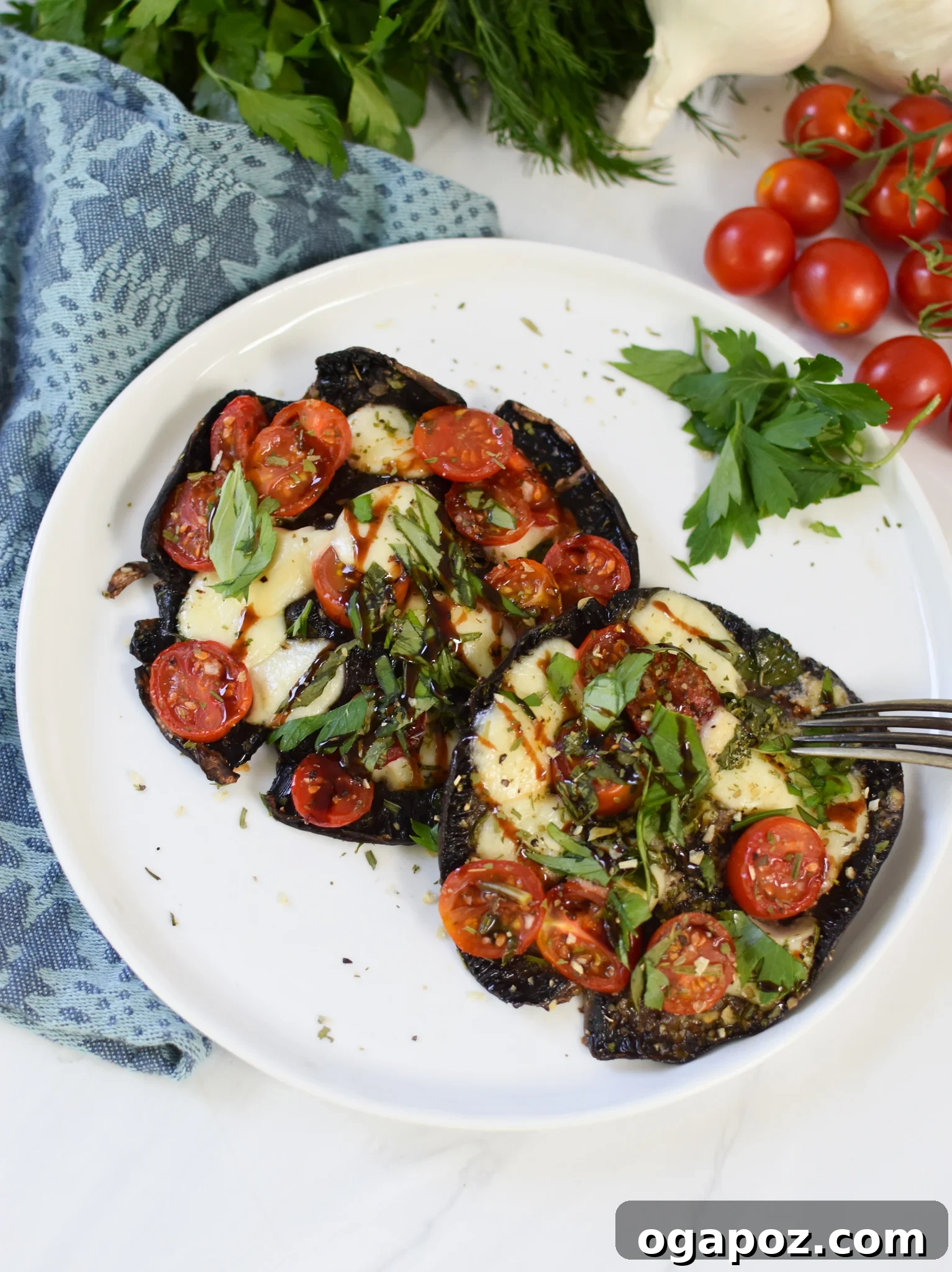 Roasted Caprese Portobellos 6 Caprese Stuffed Portobello Mushrooms elegantly arranged on a plate.