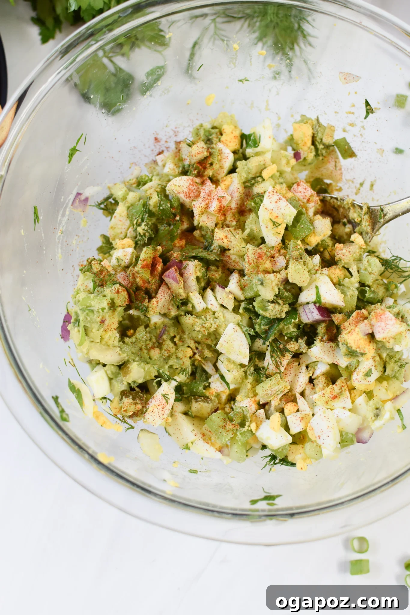 Green Goddess Egg Salad 8 Close-up of freshly mixed Avocado Egg Salad in a bowl.
