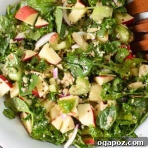 Vibrant Apple Kale Quinoa Medley 8 A top-down view of the prepared Apple Kale Quinoa Salad in a serving bowl, showcasing its colorful ingredients.
