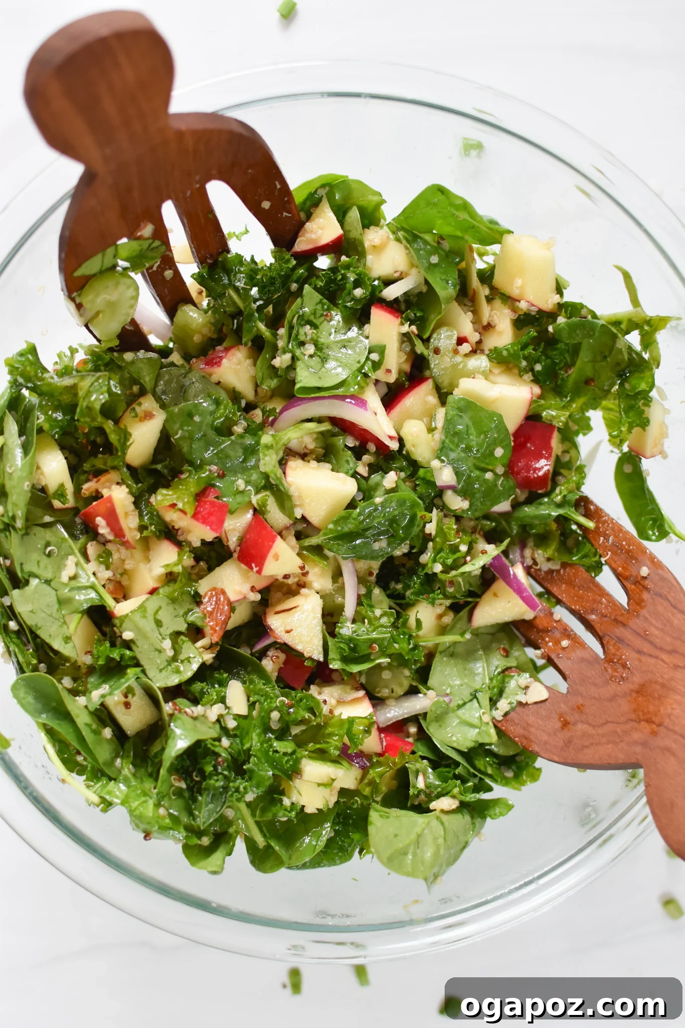 Vibrant Apple Kale Quinoa Medley 7 The vibrant Apple Kale Quinoa Salad displayed in a bowl, glistening with the maple dijon dressing and ready to be enjoyed.