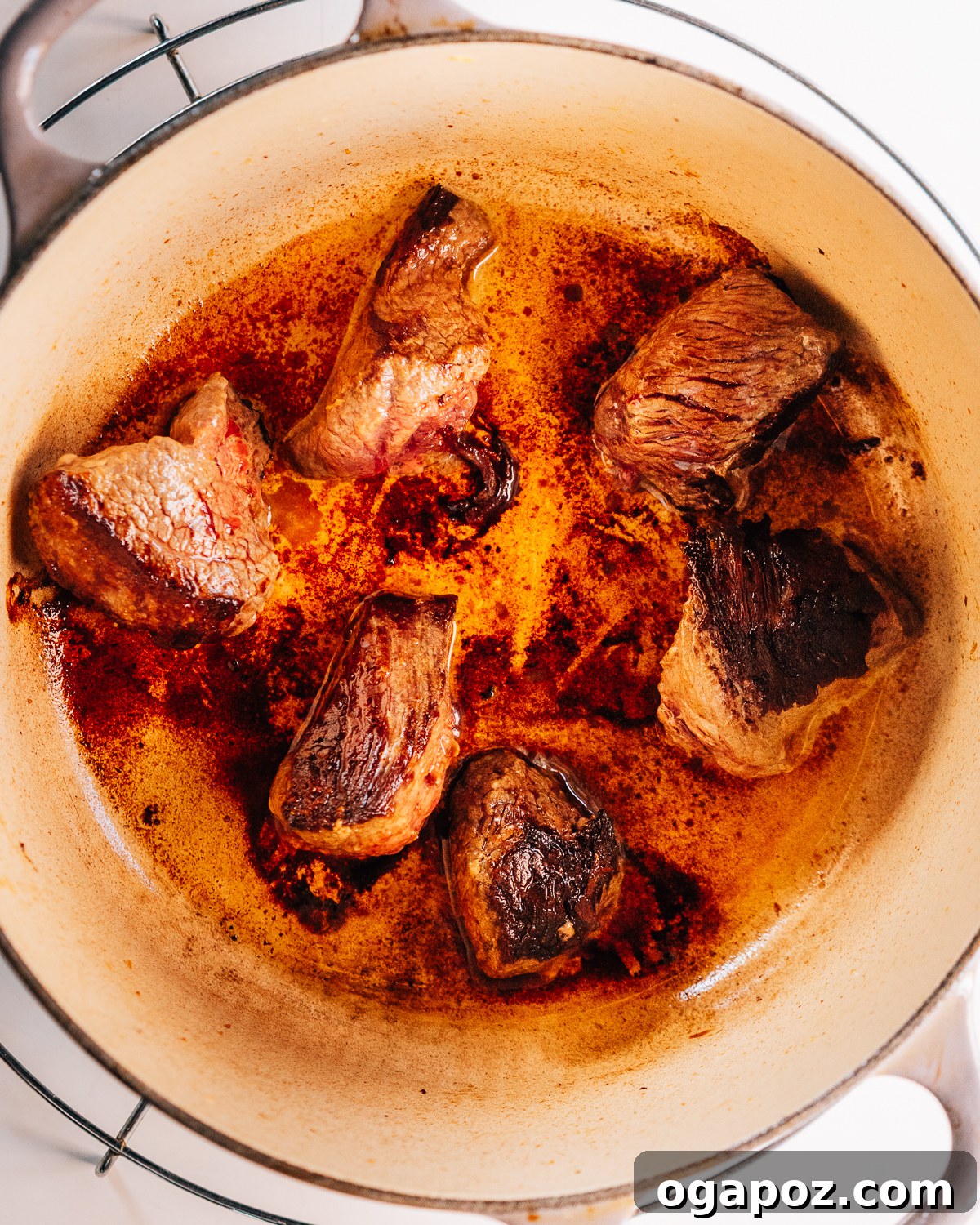 Hearty Dutch Oven Beef Feast 4 Step-by-step image of browning beef for Dutch Oven Beef Stew.