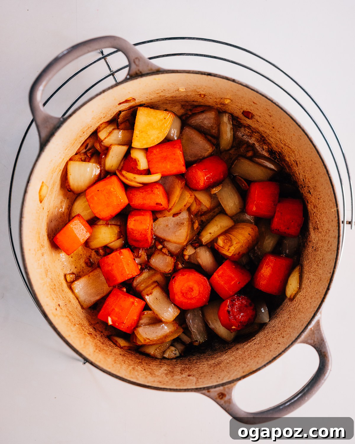 Hearty Dutch Oven Beef Feast 5 Step-by-step image of sauteing vegetables for Dutch Oven Beef Stew.