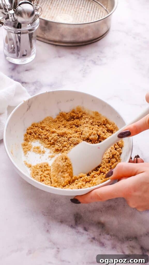 Perfect Homemade Graham Cracker Crust 7 Mixing graham cracker crumbs and butter to make crust mixture.