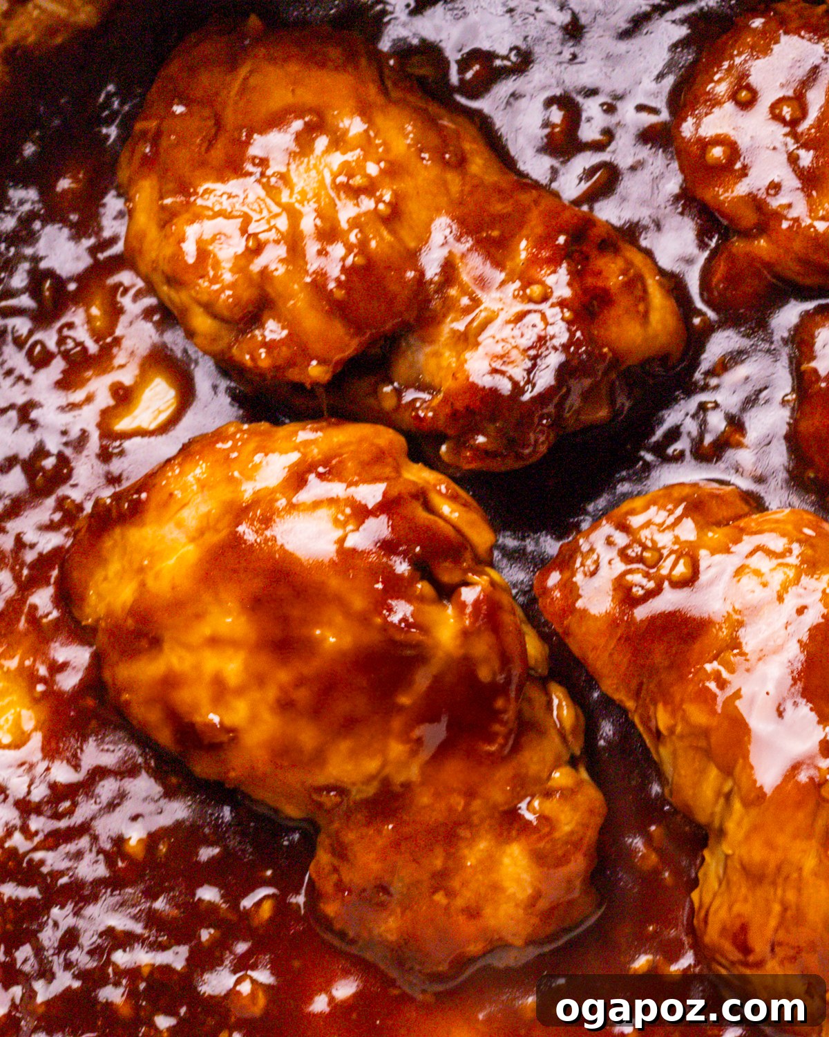 Signature Teriyaki Chicken Marinade 2 Teriyaki Chicken Marinade on chicken thighs in a pan.