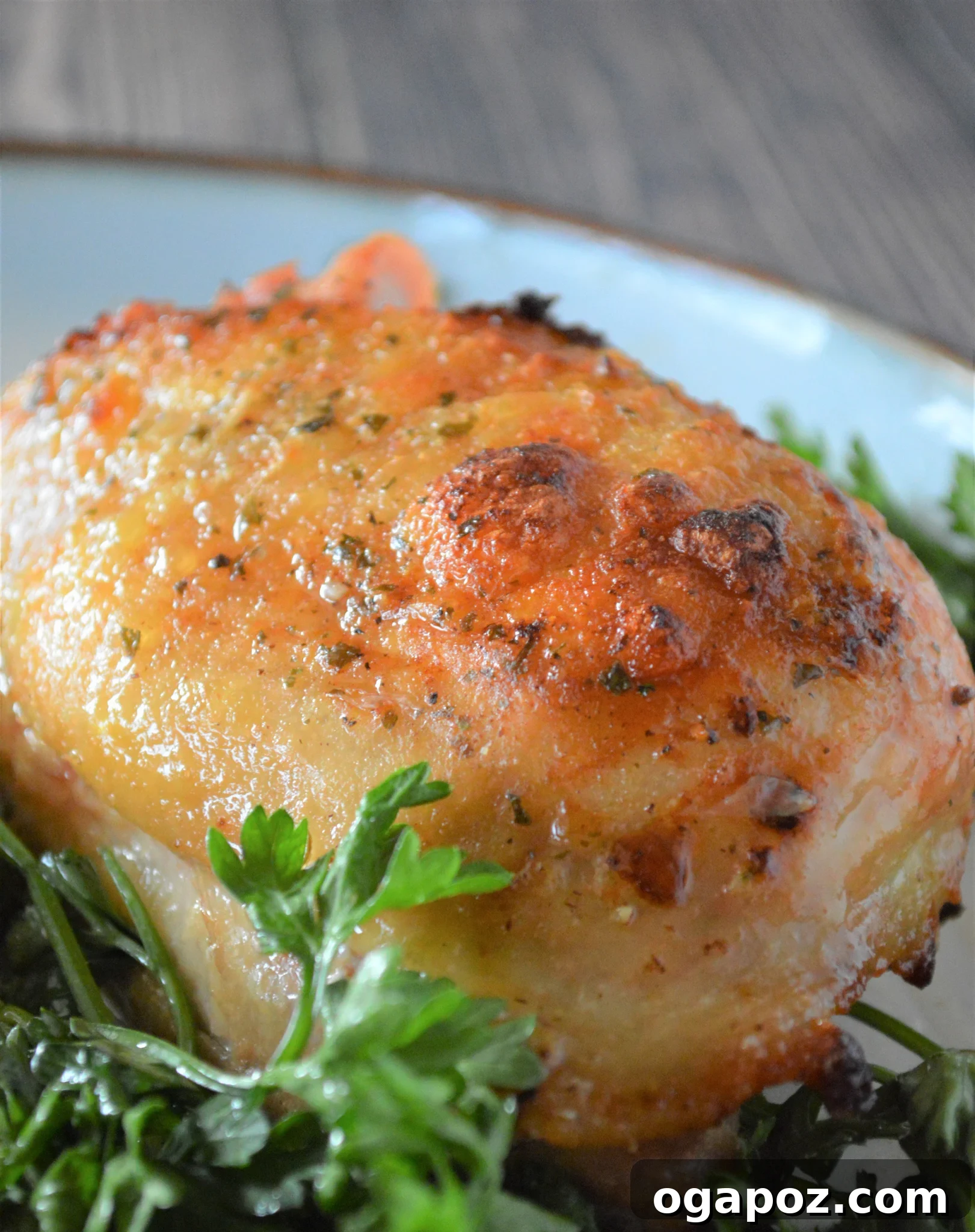 Creamy Ranch Chicken Thighs 7 Finished oven baked ranch chicken thighs resting in a white ceramic baking dish, ready to be carved and served.