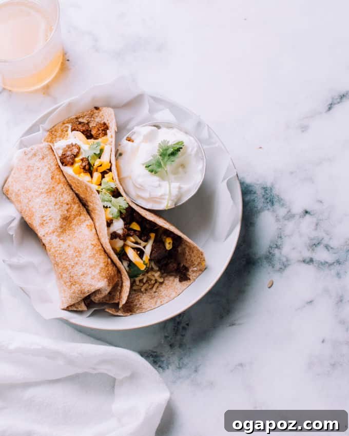 Easy Ground Beef, Rice, and Cheese Freezer Burritos 2 A perfectly rolled ground beef freezer burrito, ready to be wrapped for storage.