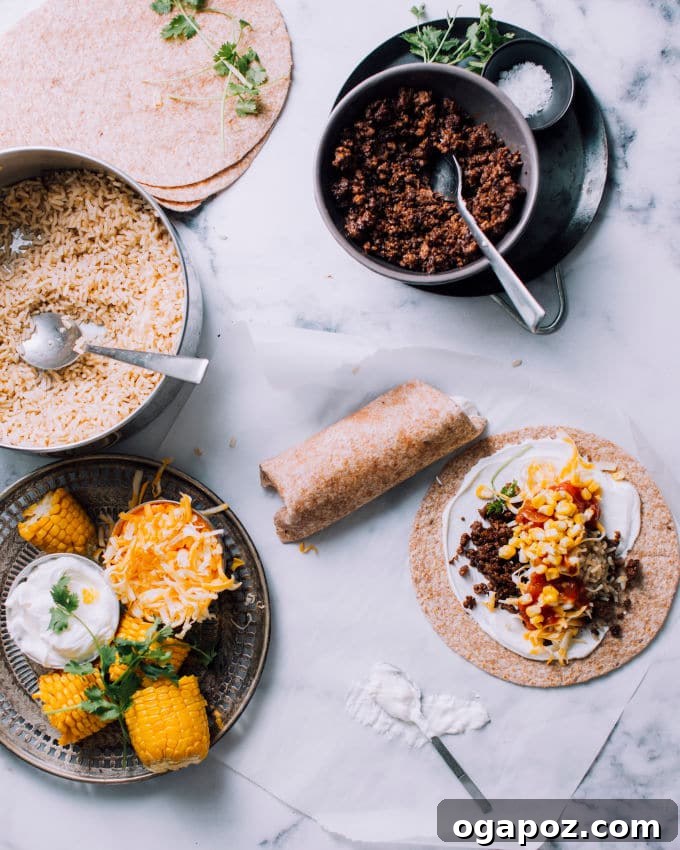 Easy Ground Beef, Rice, and Cheese Freezer Burritos 4 A vibrant selection of burrito filling ingredients laid out, including ground beef, rice, and cheese.