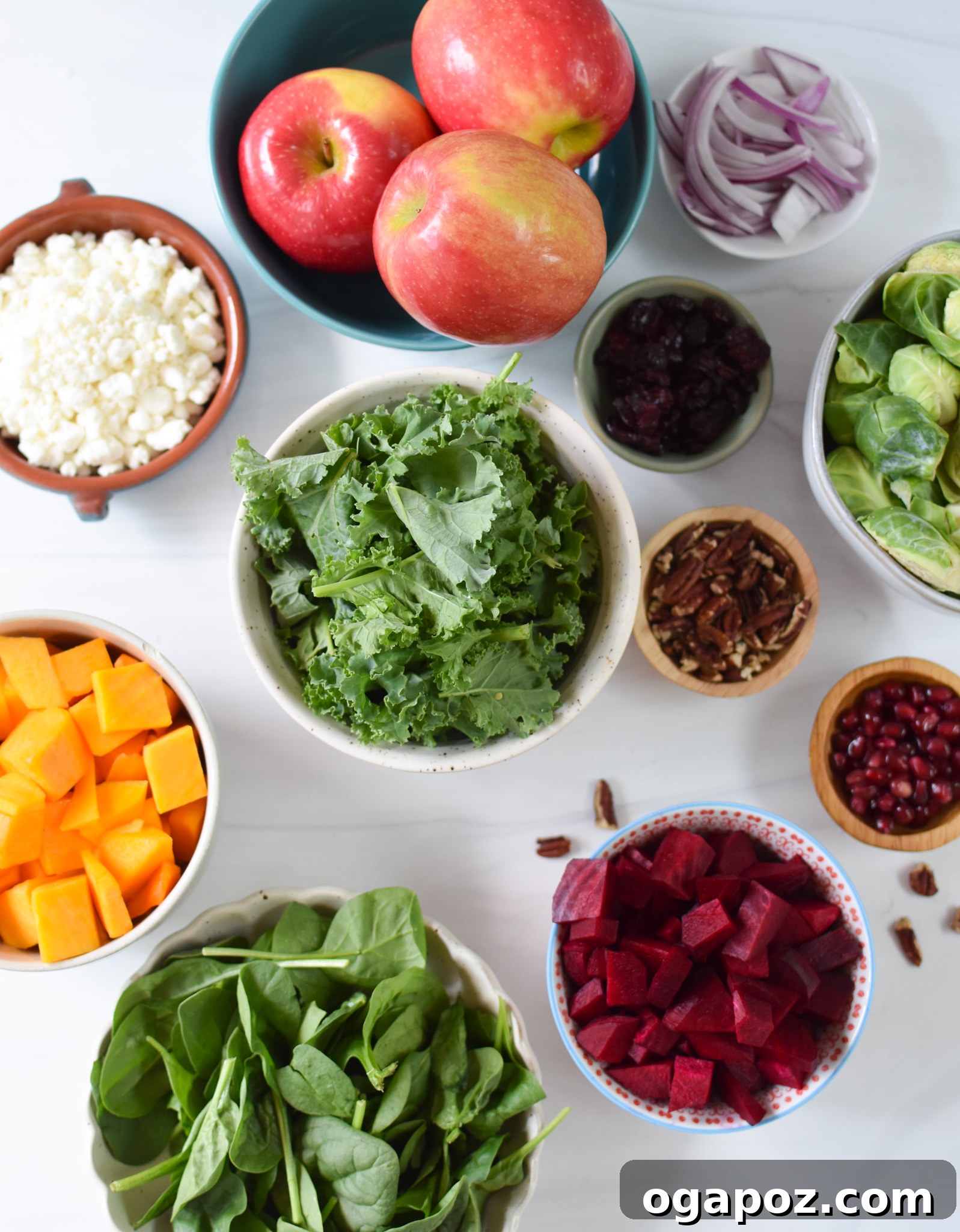 Golden Harvest Salad 3 A selection of fresh ingredients for Fall Harvest Salad, including various roasted vegetables, greens, fruits, and cheese.