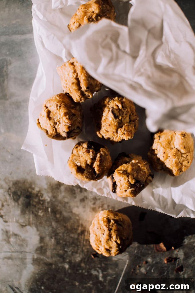 Close-up of a single coconut oatmeal cookie, highlighting its chewy texture