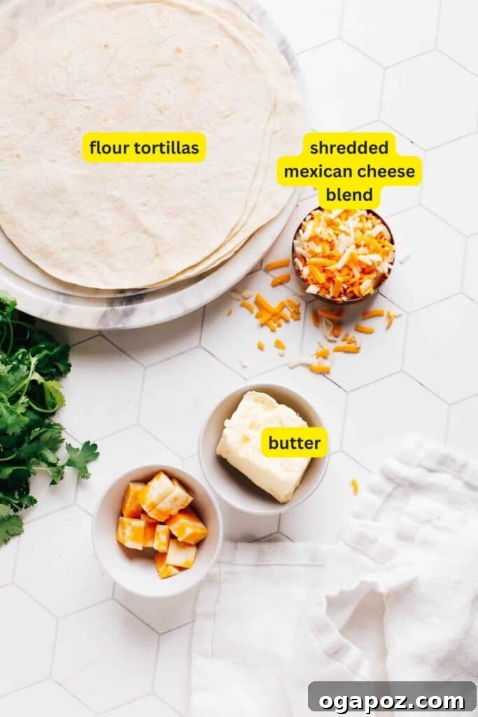 Crispy Air Fryer Quesadillas 3 Ingredients for quesadillas laid out: tortillas, shredded cheese, and butter.