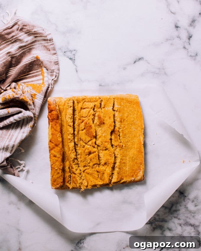 Step-by-step image of baking pumpkin roll cake batter.